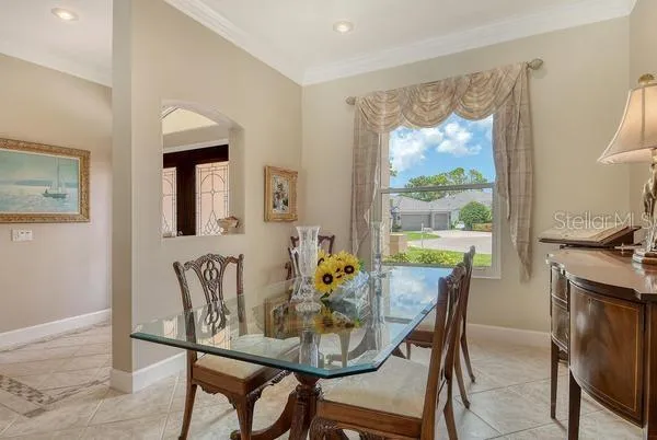 a view of a dining room with furniture window and outside view