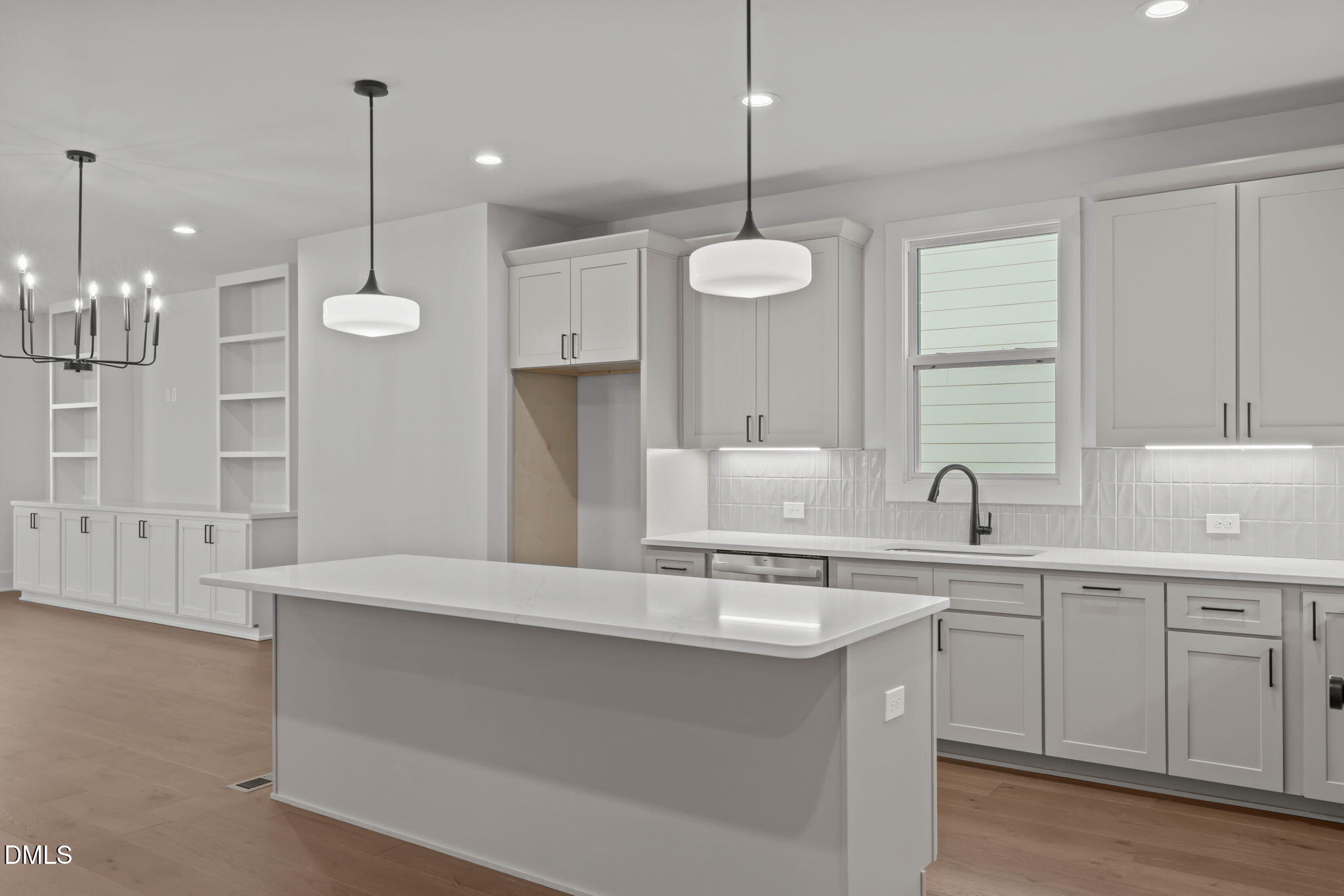 635 Conover Road, Unit A Durham, NC 27703 - Photo 1 of 48 a large kitchen with kitchen island a sink stainless steel appliances and cabinets