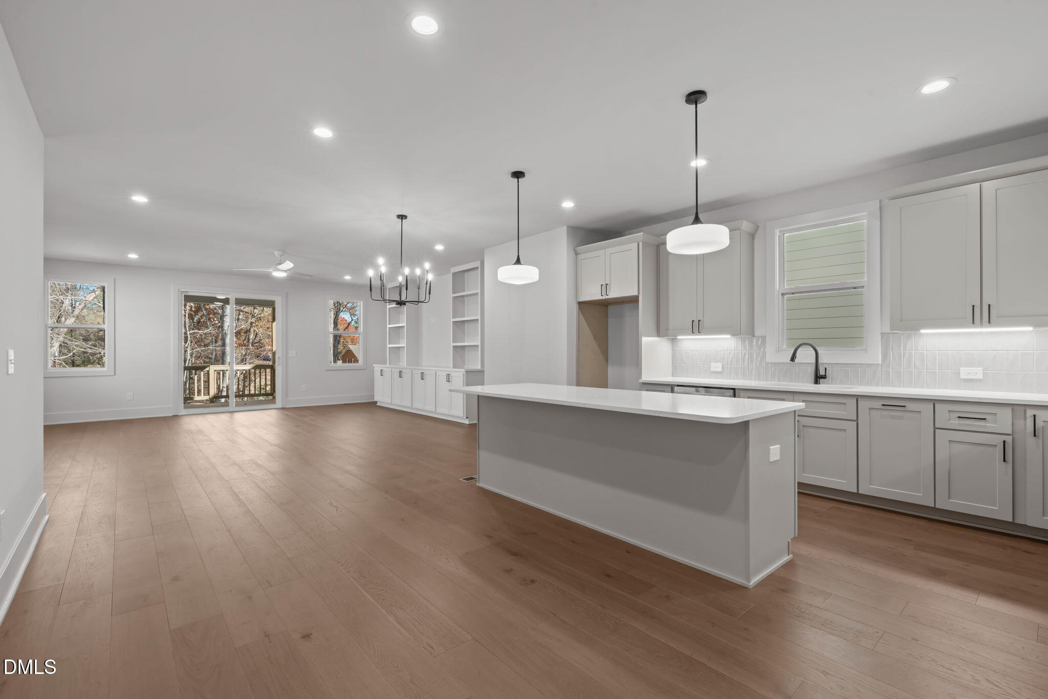 635 Conover Road, Unit A Durham, NC 27703 - Photo 16 of 48 a large kitchen with granite countertop a large counter top a sink stainless steel appliances and cabinets