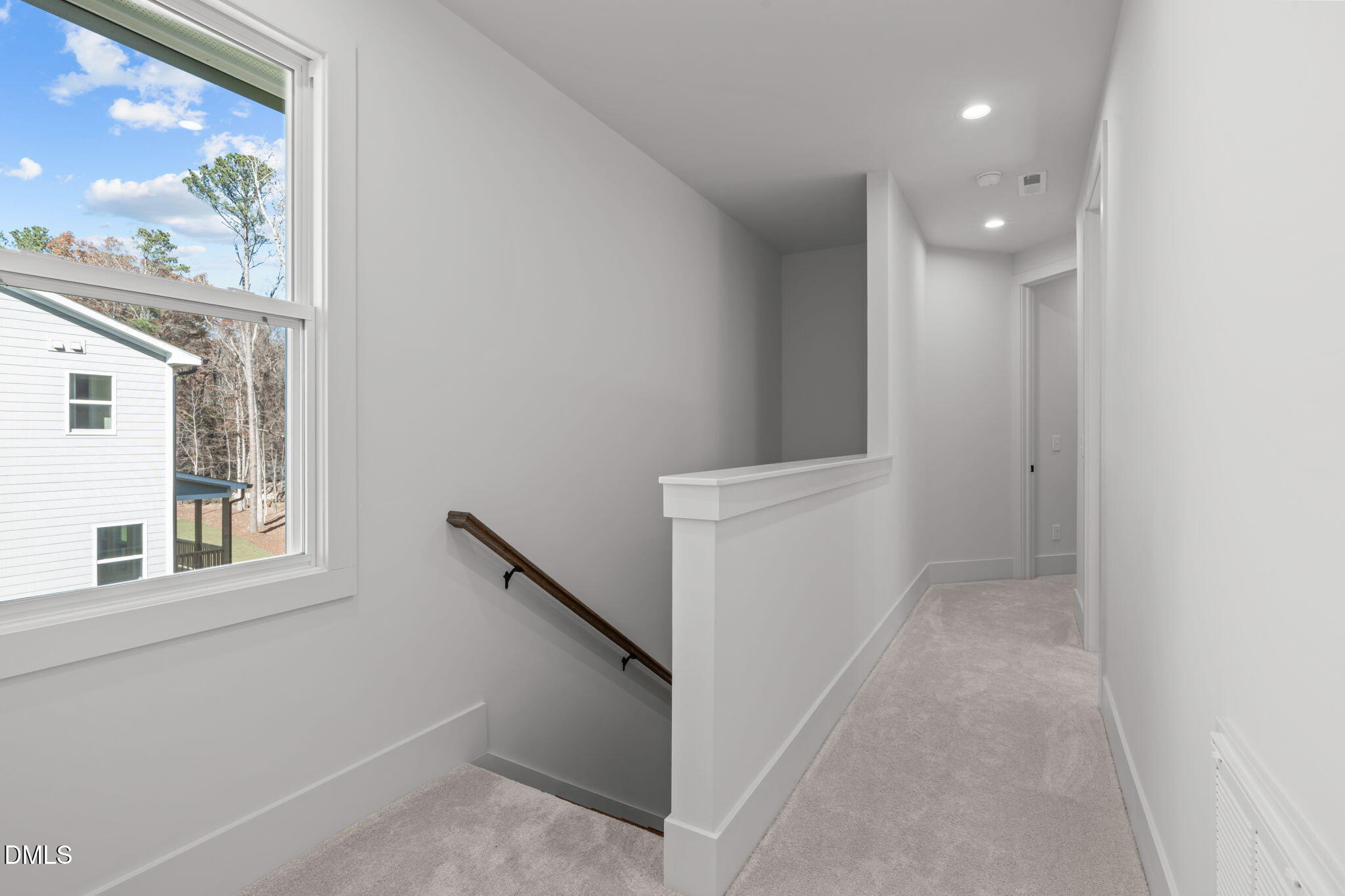 635 Conover Road, Unit A Durham, NC 27703 - Photo 22 of 48 a view of hallway with window and wooden floor