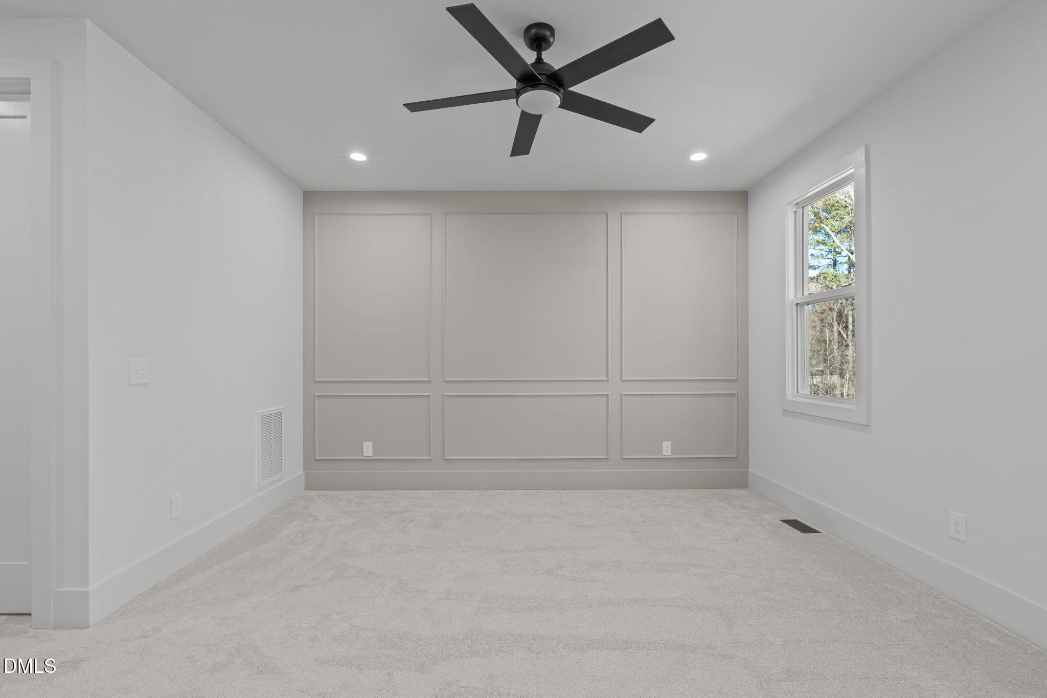 635 Conover Road, Unit A Durham, NC 27703 - Photo 27 of 48 an empty room with a empty space and a ceiling fan
