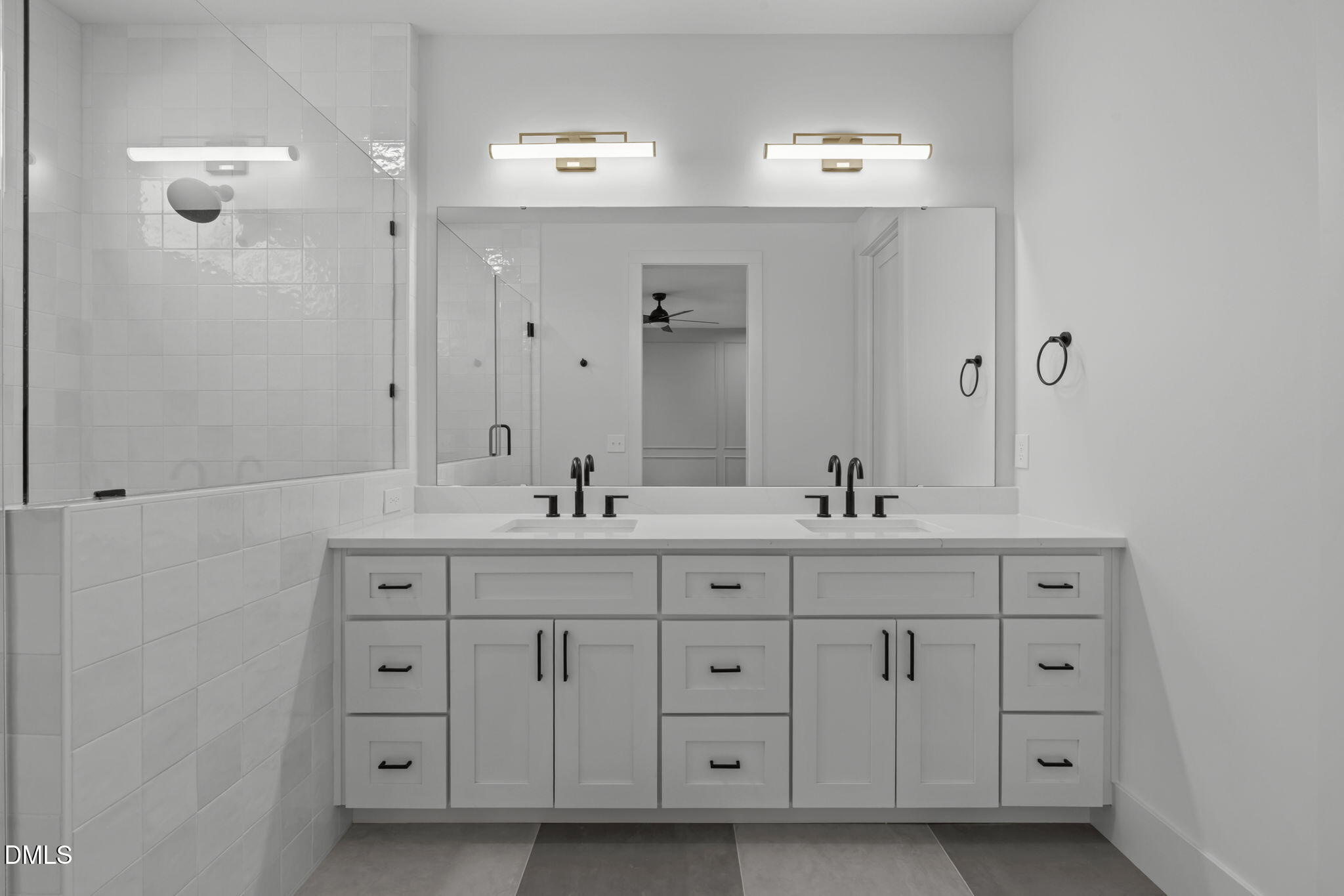 635 Conover Road, Unit A Durham, NC 27703 - Photo 28 of 48 a bathroom with double sink and a mirror