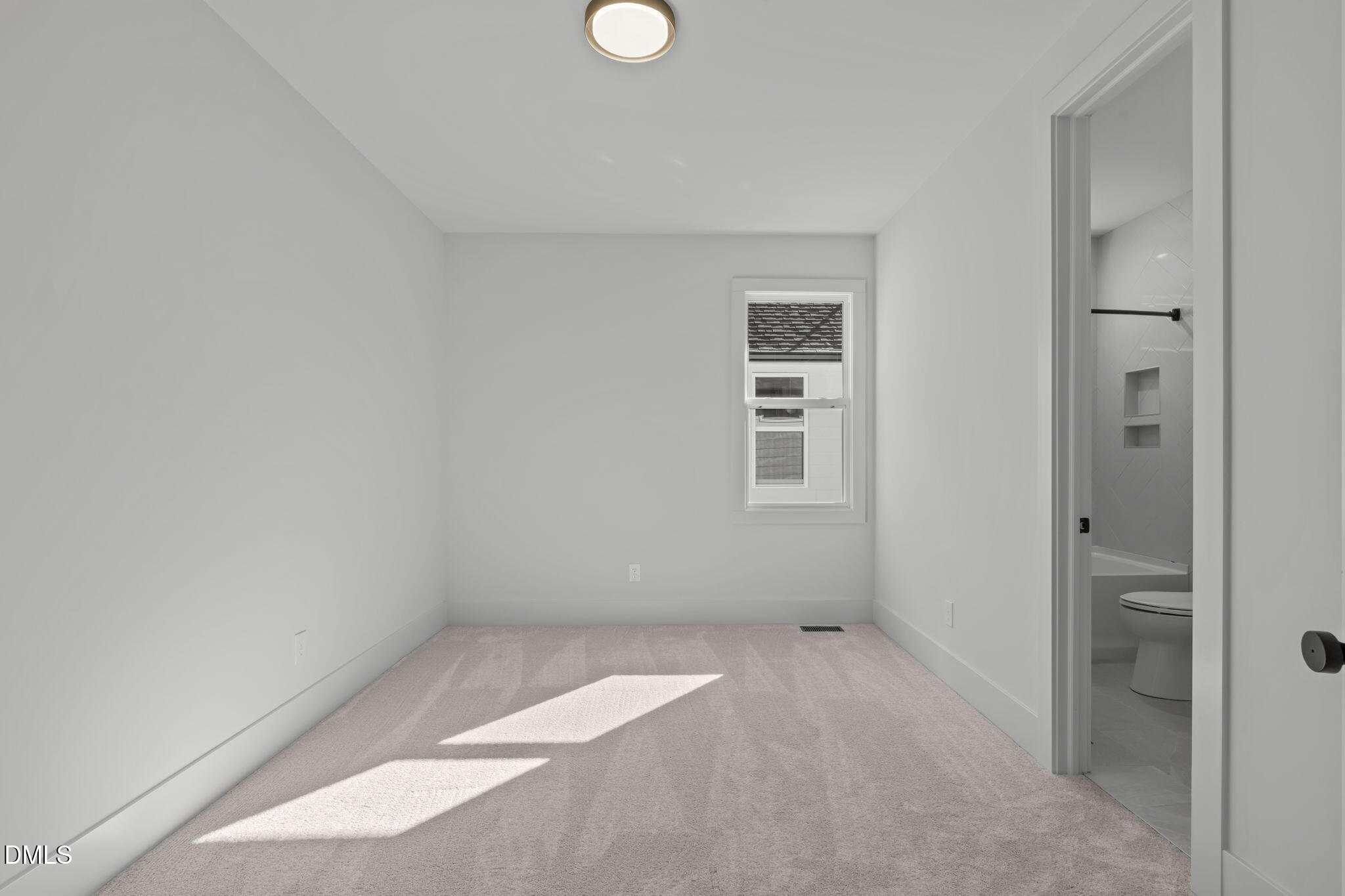 635 Conover Road, Unit A Durham, NC 27703 - Photo 31 of 48 an empty room with windows