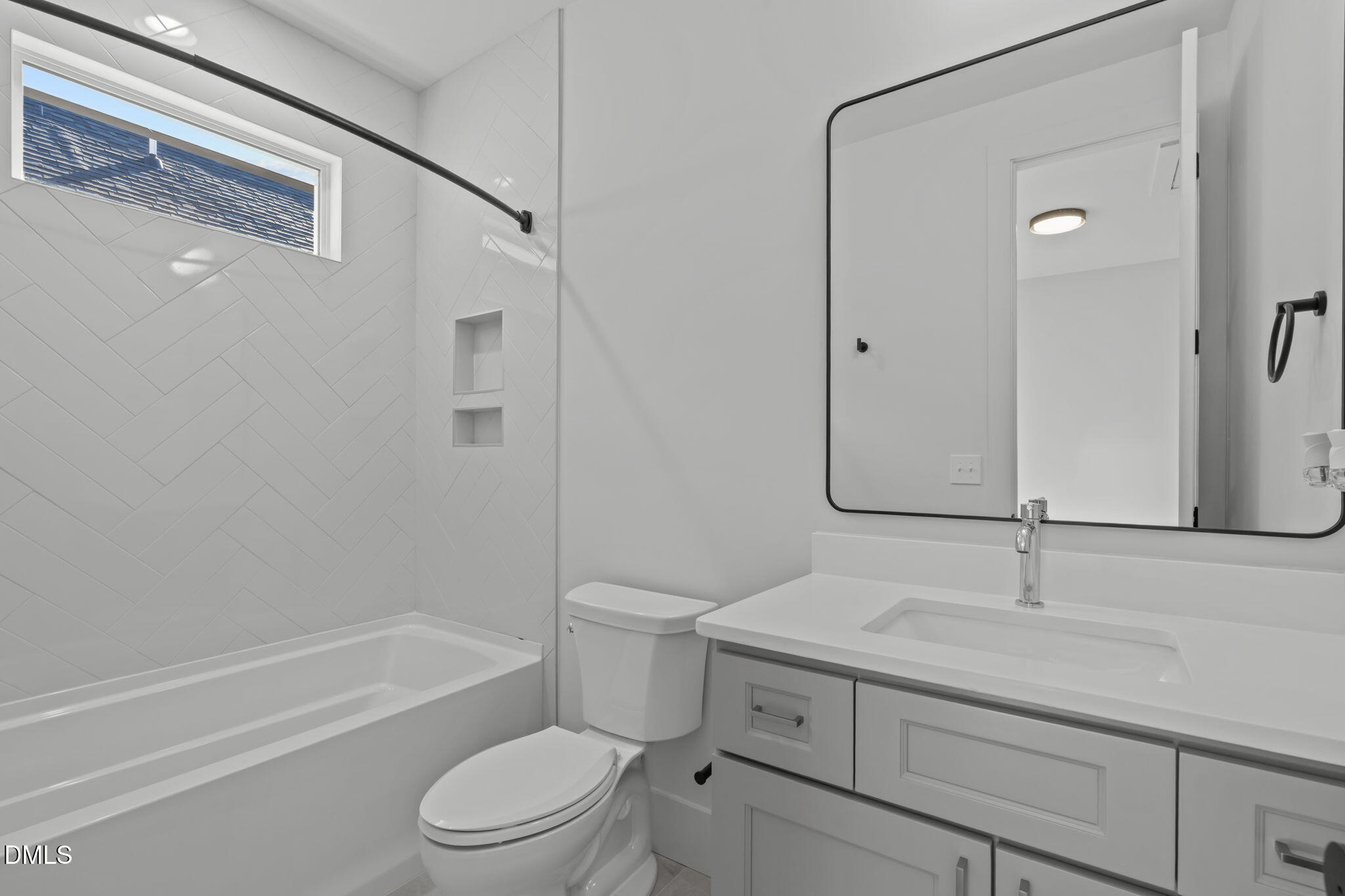 635 Conover Road, Unit A Durham, NC 27703 - Photo 33 of 48 a bathroom with a sink a toilet and shower