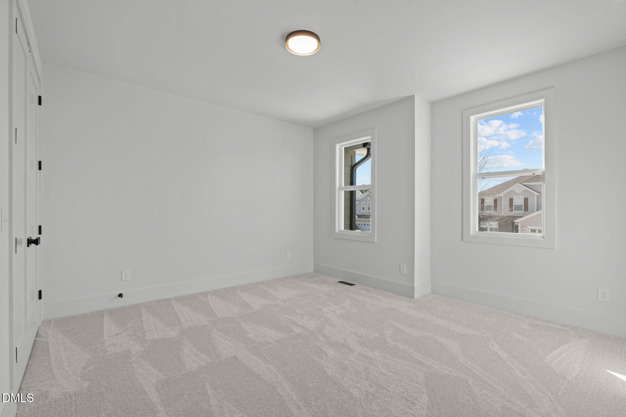 635 Conover Road, Unit A Durham, NC 27703 - Photo 38 of 48 an empty room with windows