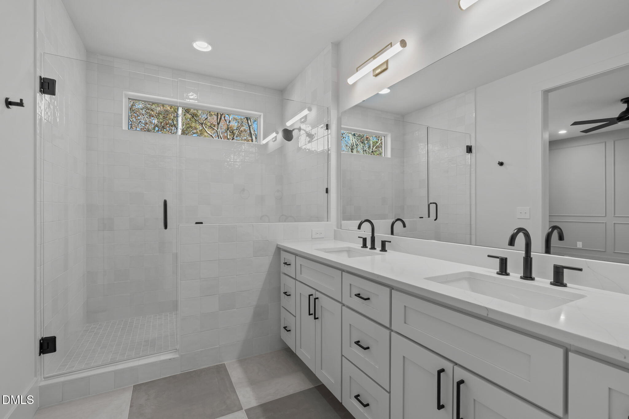 635 Conover Road, Unit A Durham, NC 27703 - Photo 3 of 48 a bathroom with double sink and a shower