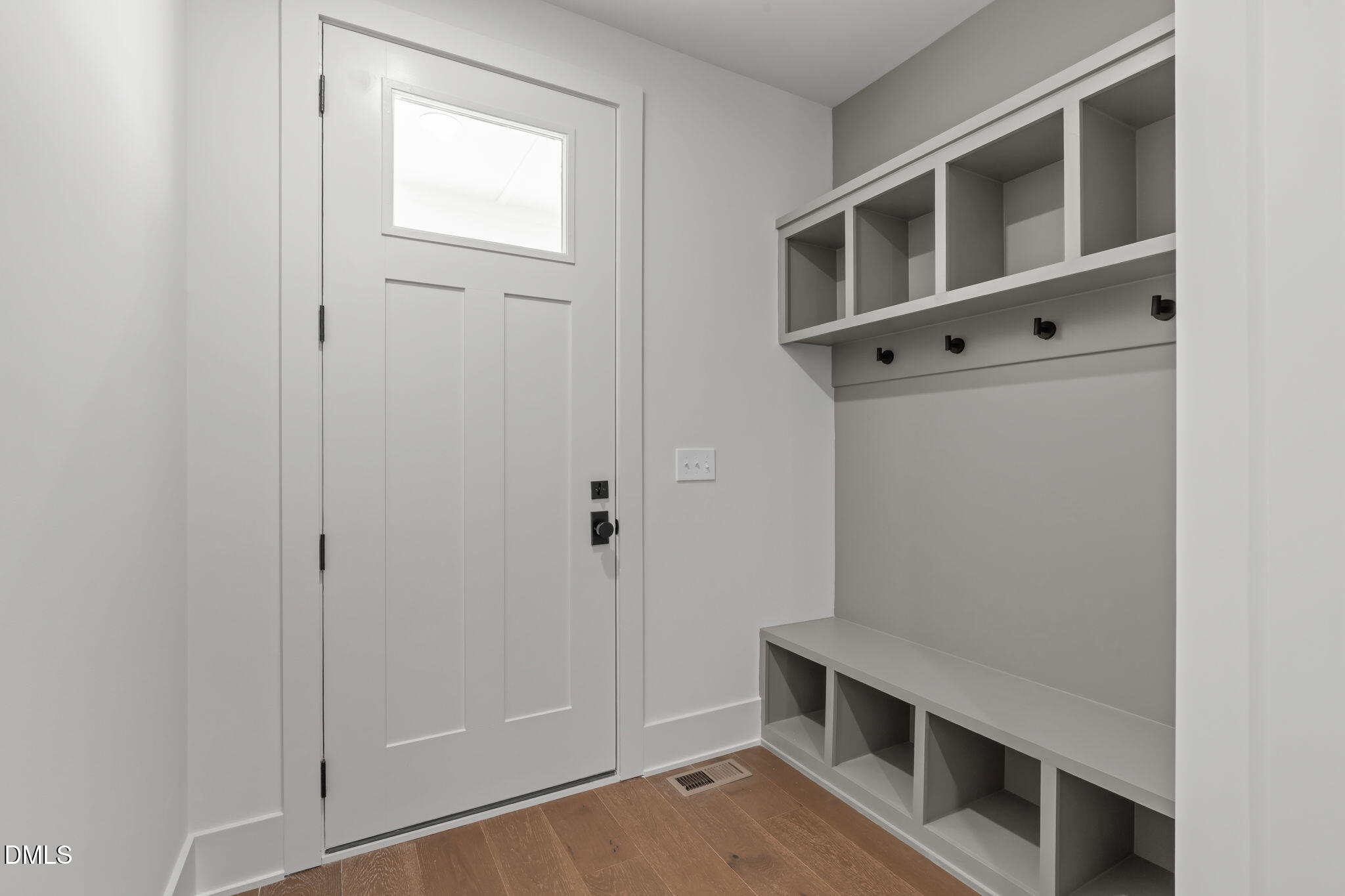635 Conover Road, Unit A Durham, NC 27703 - Photo 7 of 48 a view of an empty room with cabinet and entryway