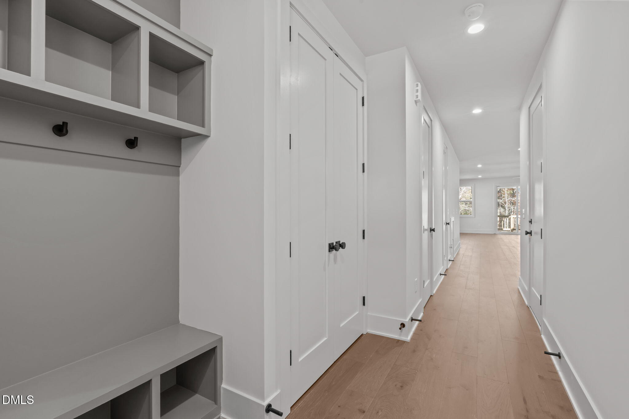 635 Conover Road, Unit A Durham, NC 27703 - Photo 8 of 48 a view of a hallway with wooden floor and staircase