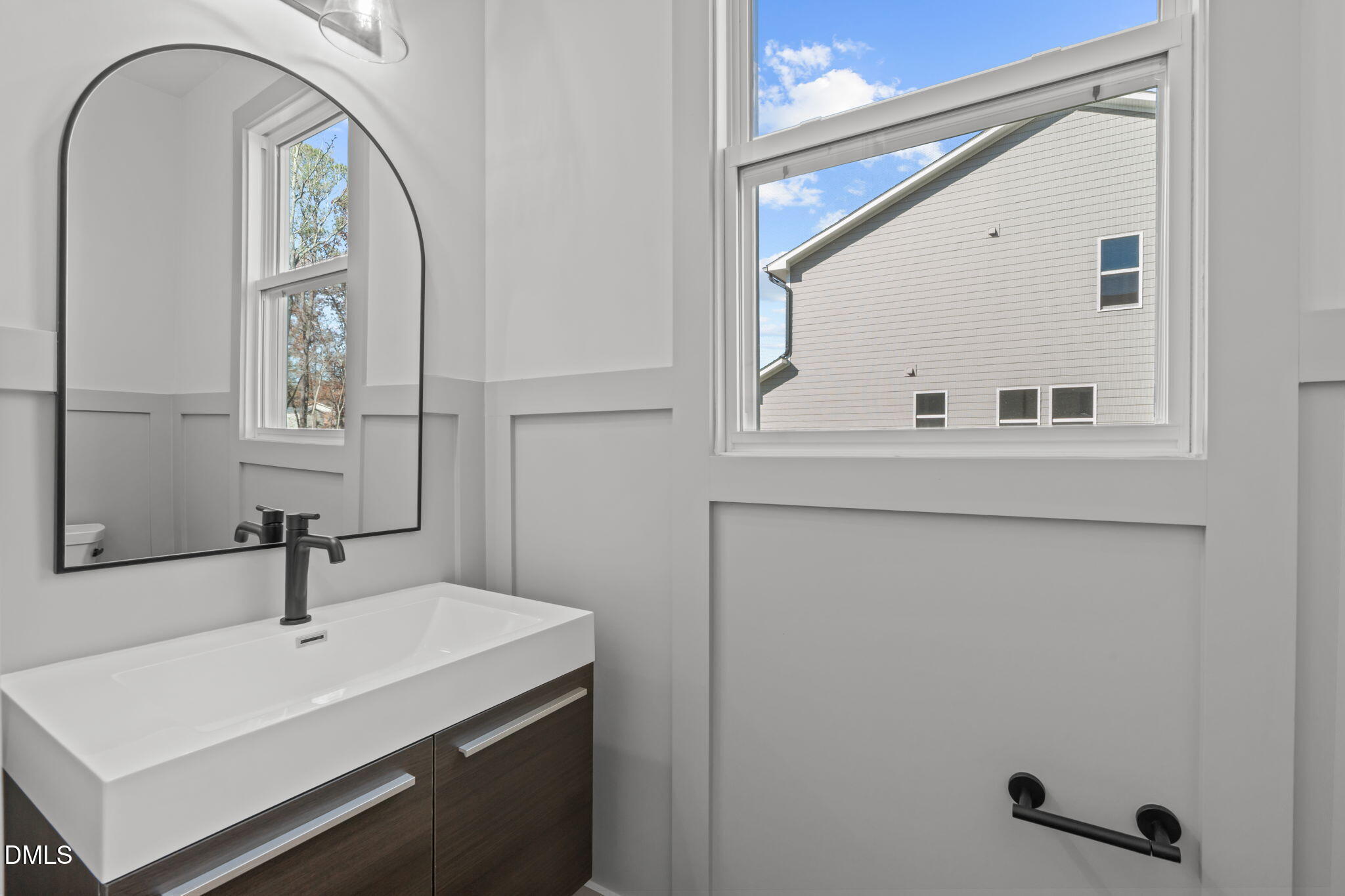 635 Conover Road, Unit A Durham, NC 27703 - Photo 9 of 48 a bathroom with a sink and a mirror