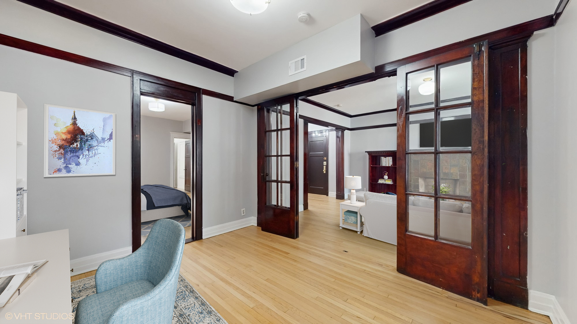 5237 South Michigan Avenue, Unit 1N Chicago, IL 60615 - Photo 11 of 47 a bedroom with a bed and wooden floor