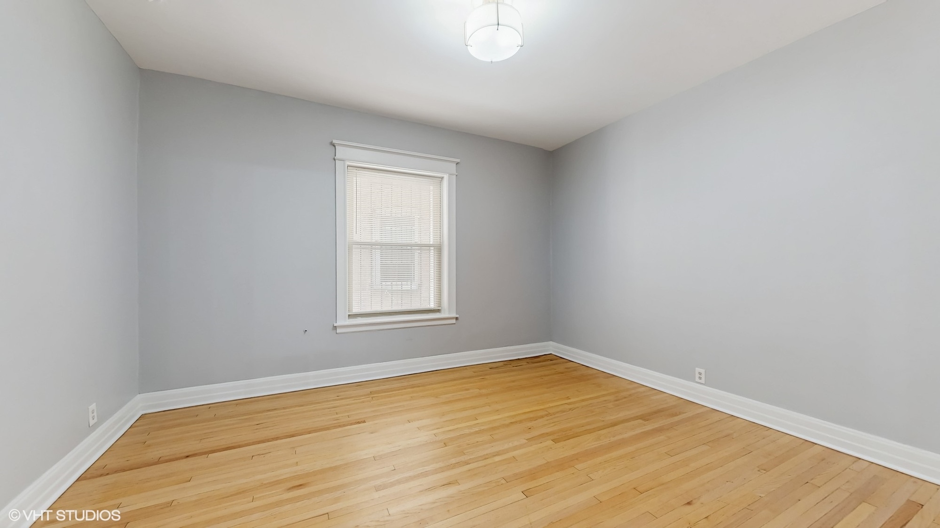 5237 South Michigan Avenue, Unit 1N Chicago, IL 60615 - Photo 29 of 47 an empty room with a window