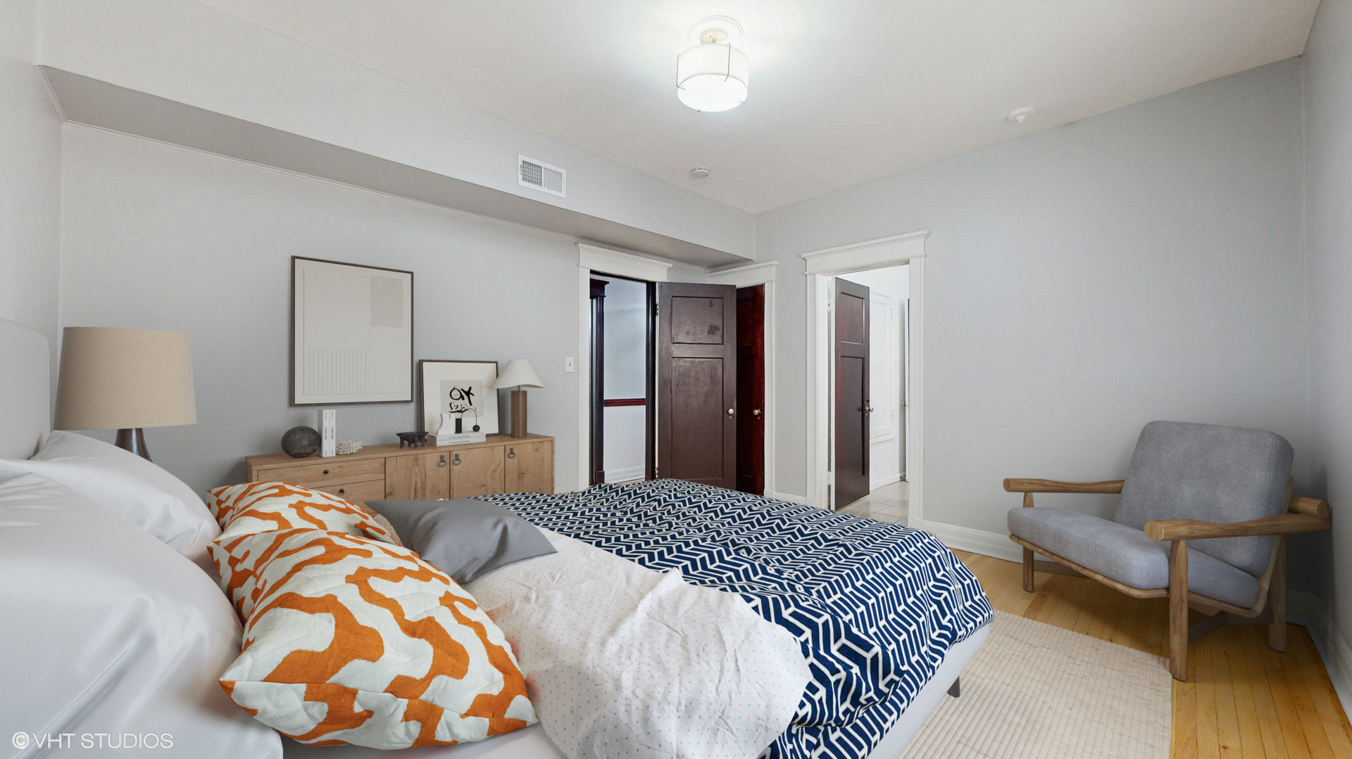 5237 South Michigan Avenue, Unit 1N Chicago, IL 60615 - Photo 30 of 47 a bedroom with two beds and painting on the wall