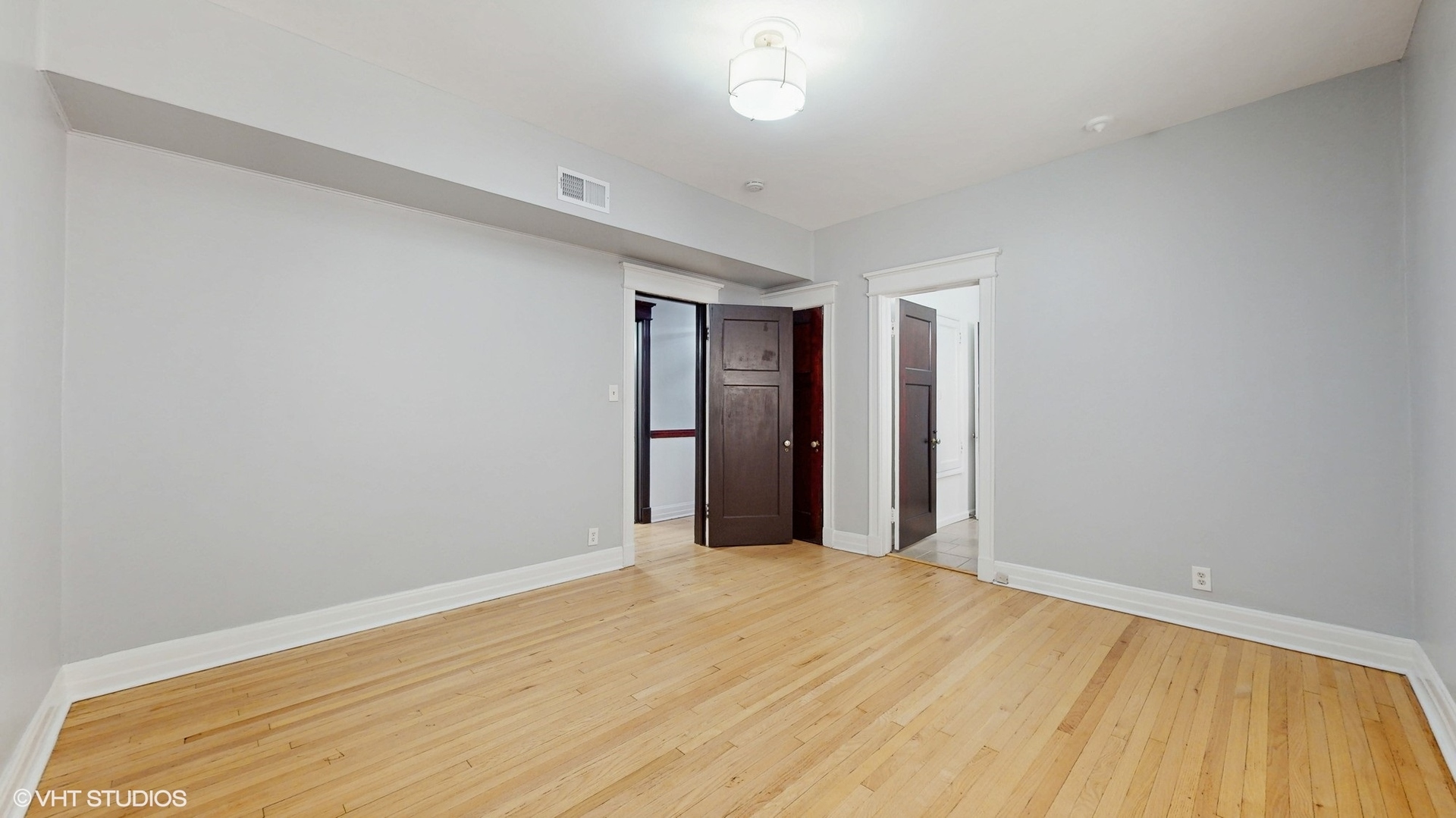 5237 South Michigan Avenue, Unit 1N Chicago, IL 60615 - Photo 31 of 47 a view of empty room with wooden floor