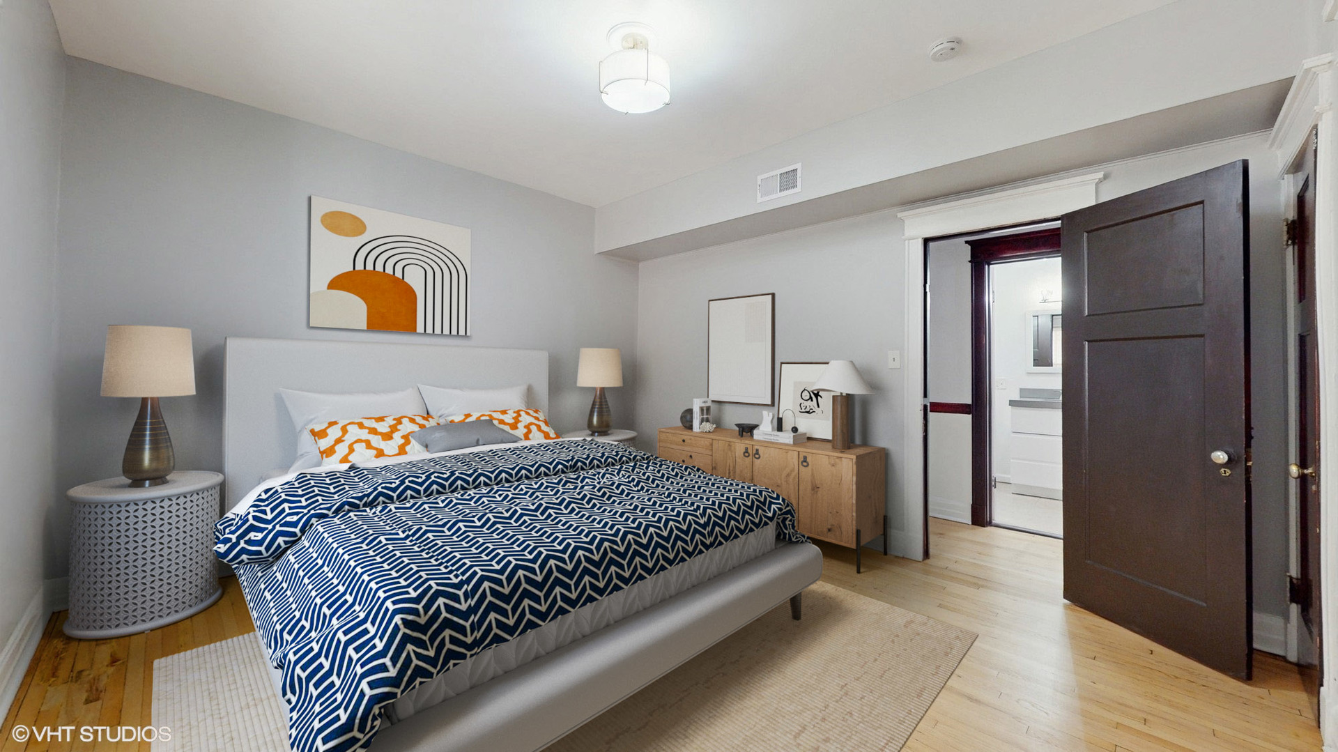 5237 South Michigan Avenue, Unit 1N Chicago, IL 60615 - Photo 32 of 47 a bedroom with a bed and dresser