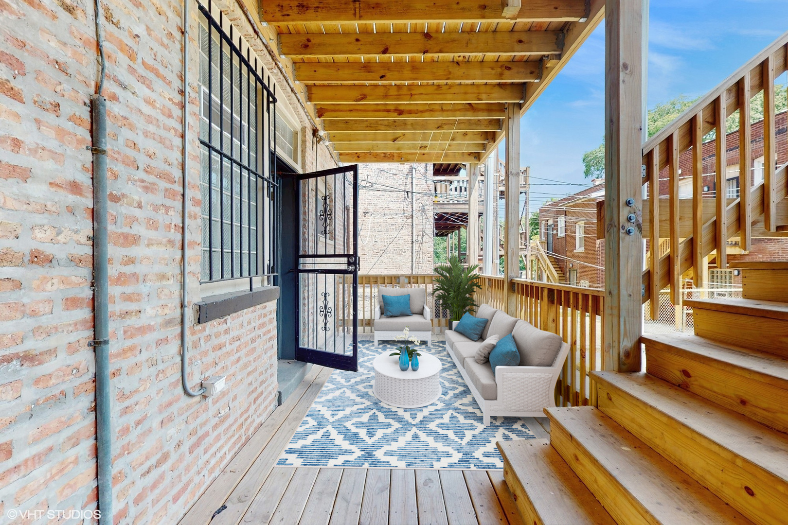 5237 South Michigan Avenue, Unit 1N Chicago, IL 60615 - Photo 41 of 47 a view of balcony with couch and wooden floor