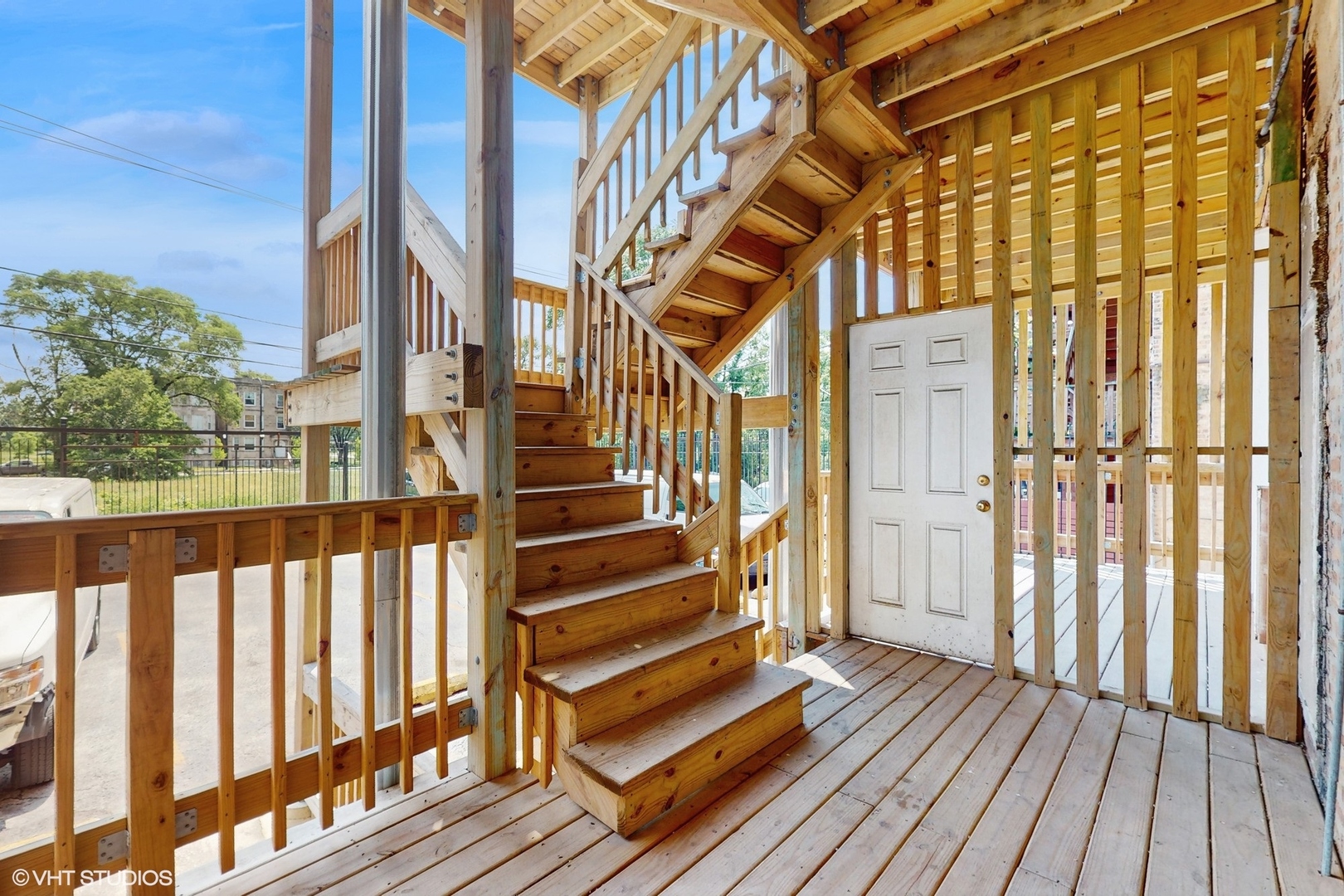 5237 South Michigan Avenue, Unit 1N Chicago, IL 60615 - Photo 45 of 47 a view of balcony with wooden floor and fence