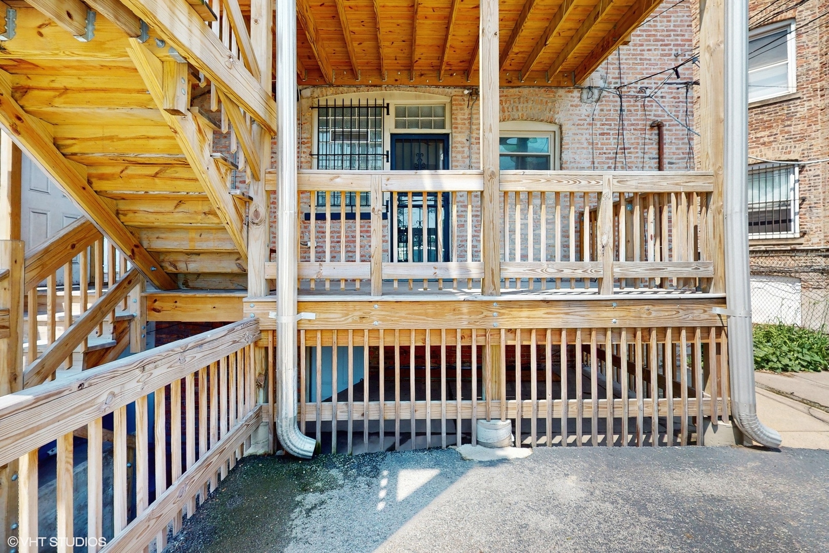 5237 South Michigan Avenue, Unit 1N Chicago, IL 60615 - Photo 46 of 47 a view of a brick building from a balcony