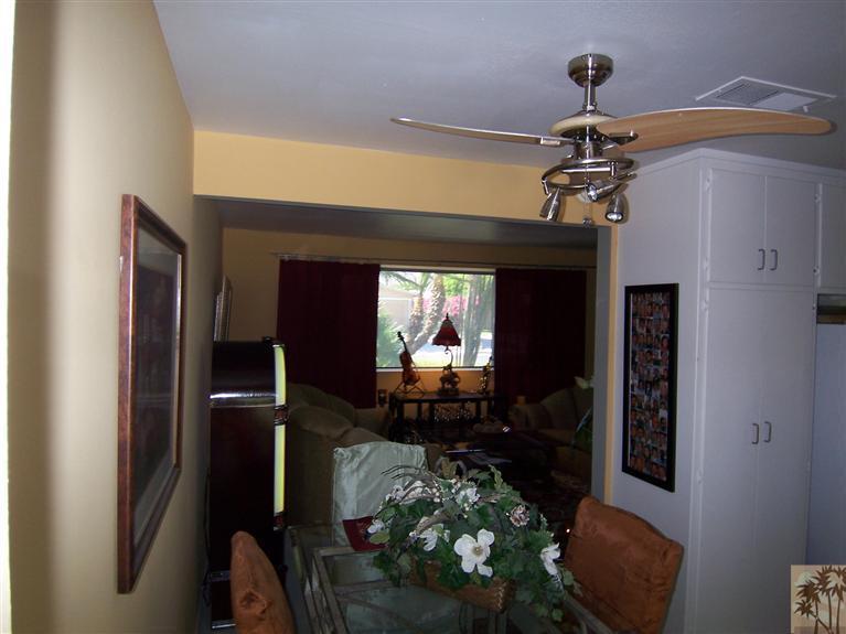 70170 Chappel Road Rancho Mirage, CA 92270 - Photo 6 of 14 a man sitting on a bench in kitchen