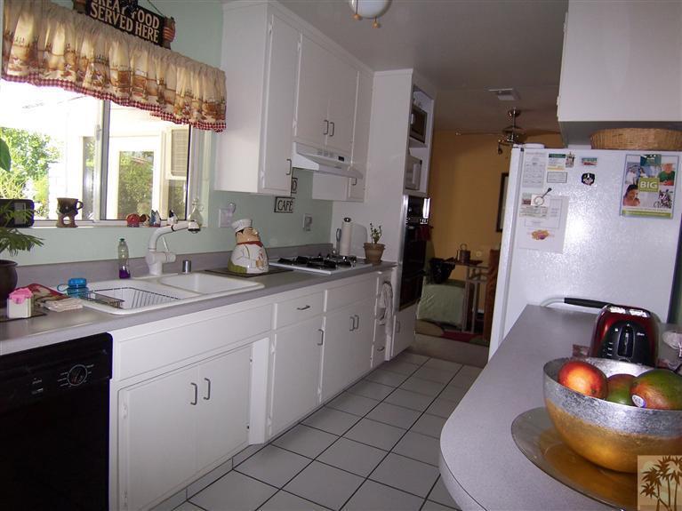 70170 Chappel Road Rancho Mirage, CA 92270 - Photo 8 of 14 a kitchen with a sink and cabinets