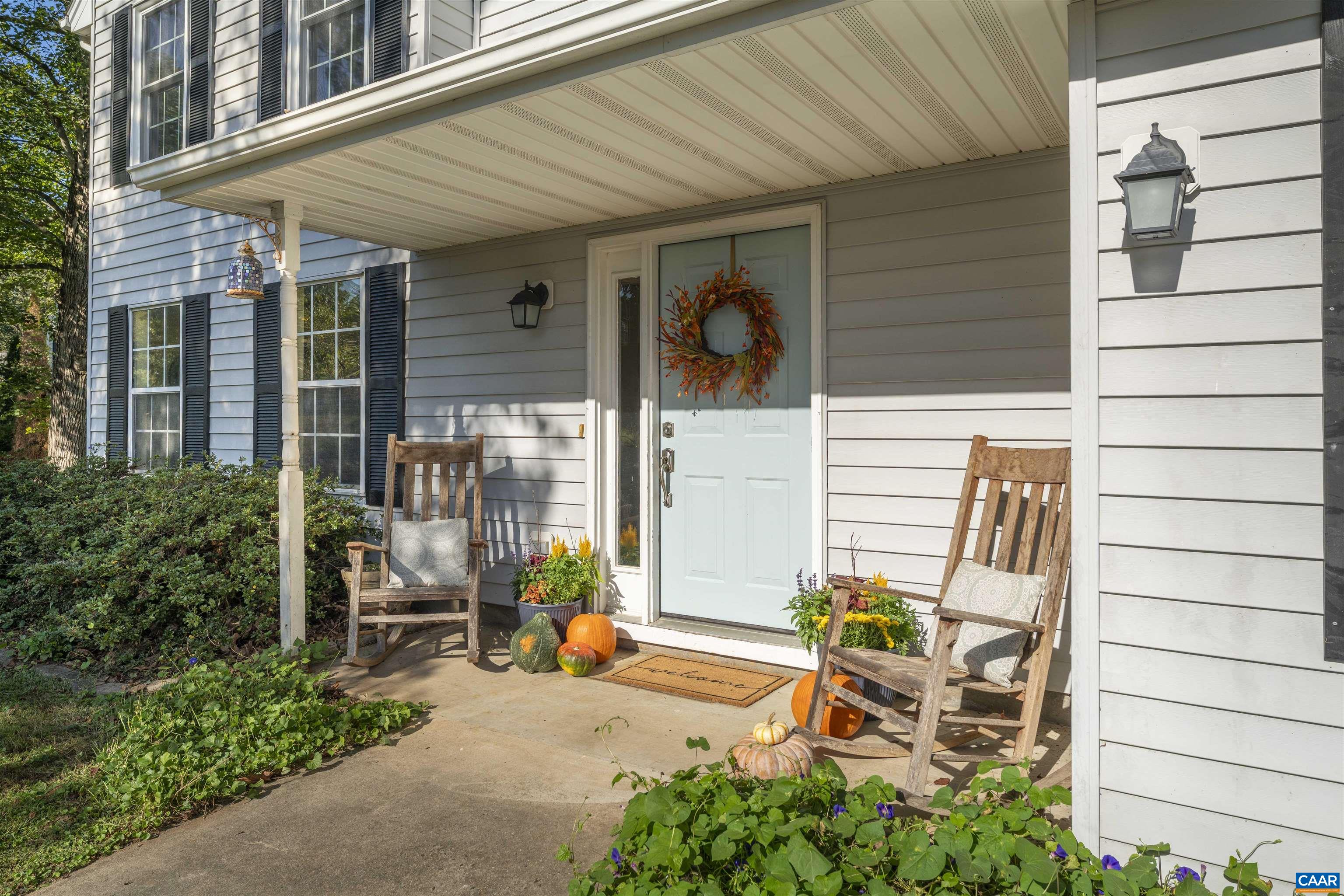 28 Bernice Lane Ruckersville, VA 22968 - Photo 2 of 40 a backyard of a house with table and chairs