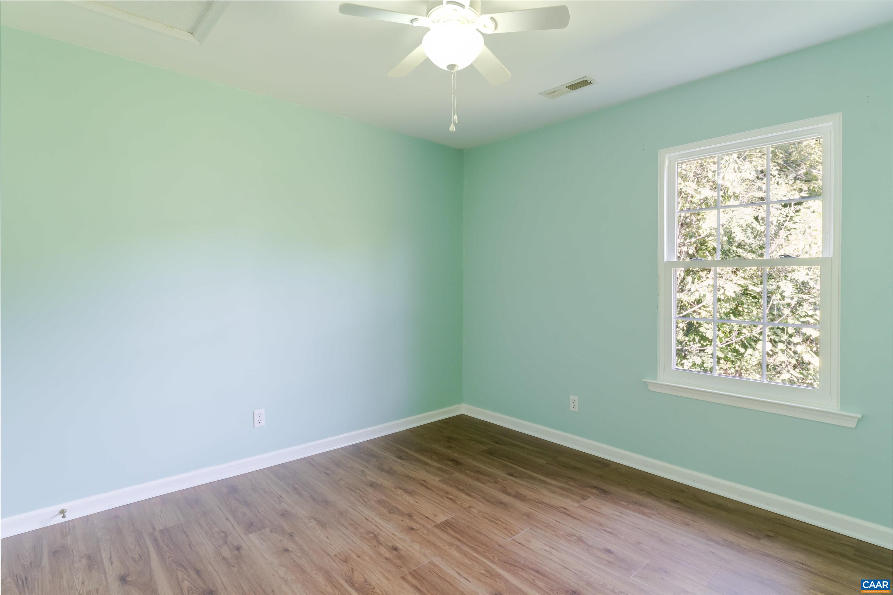 28 Bernice Lane Ruckersville, VA 22968 - Photo 26 of 40 an empty room with wooden floor and windows