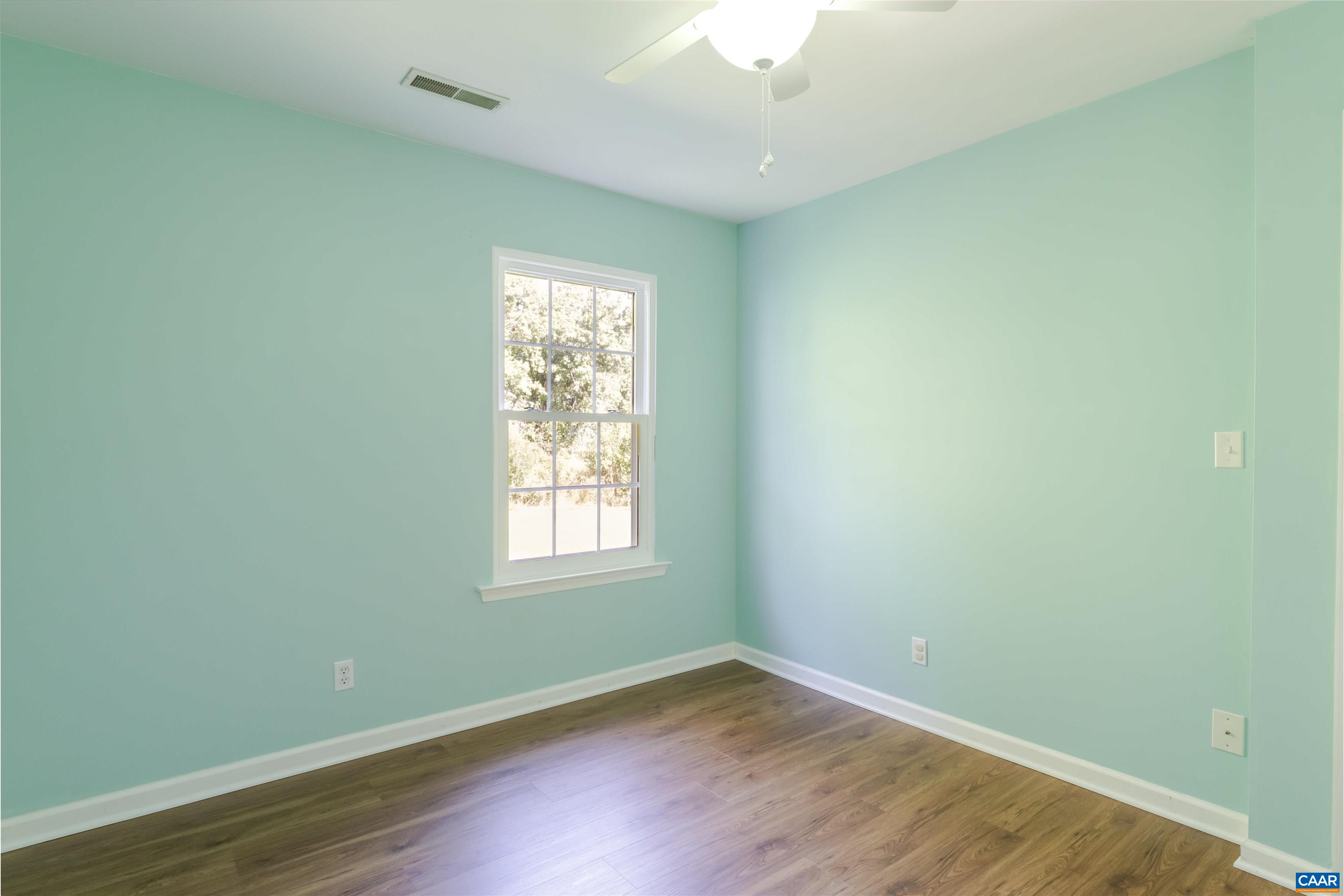 28 Bernice Lane Ruckersville, VA 22968 - Photo 27 of 40 an empty room with wooden floor and windows