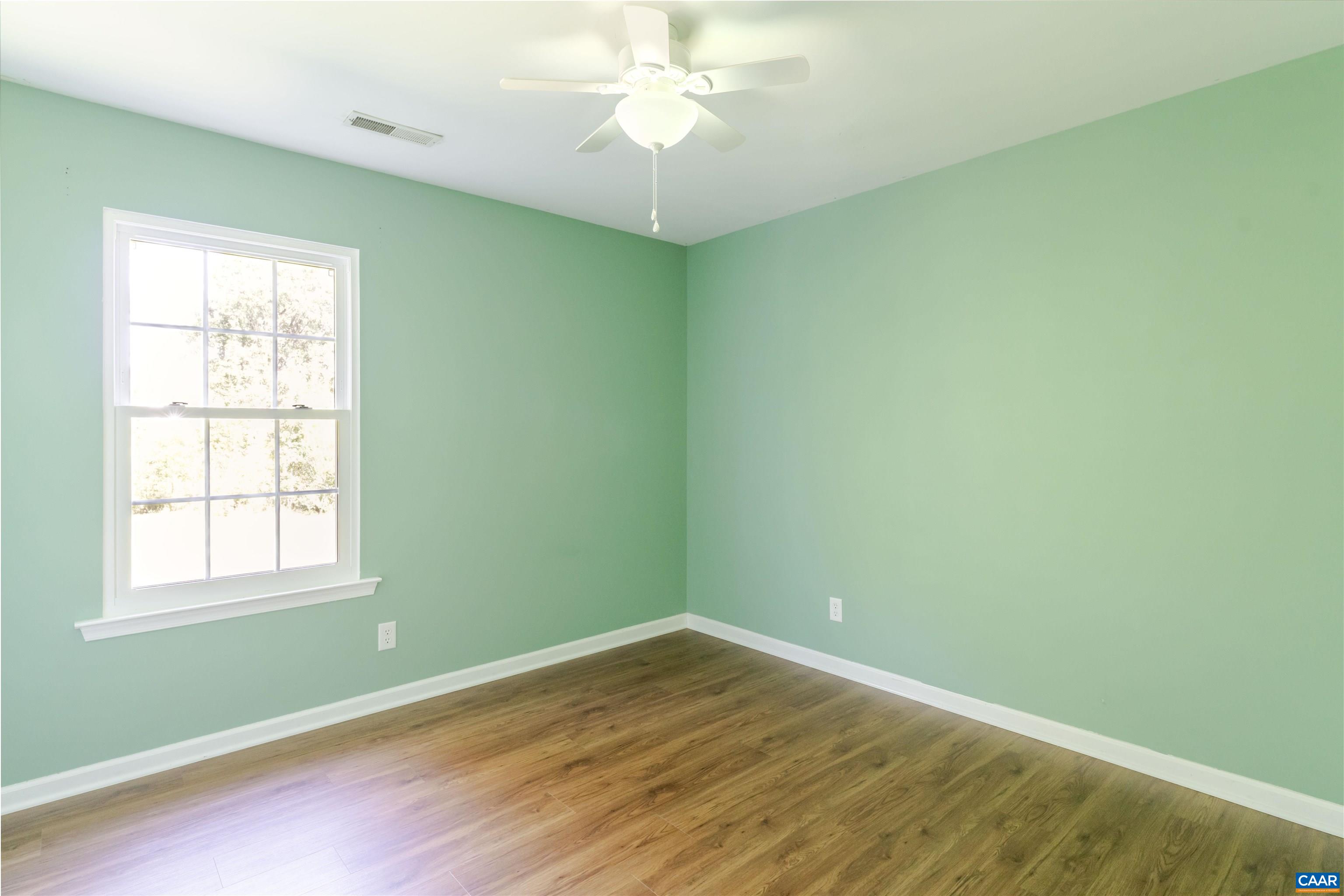 28 Bernice Lane Ruckersville, VA 22968 - Photo 30 of 40 an empty room with a window and a fan