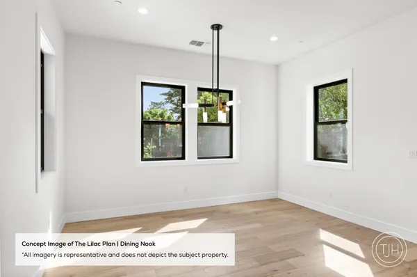 a view of an empty room with window and cabinet