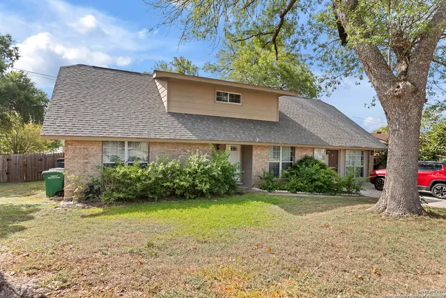 a view of a house with garden and yard