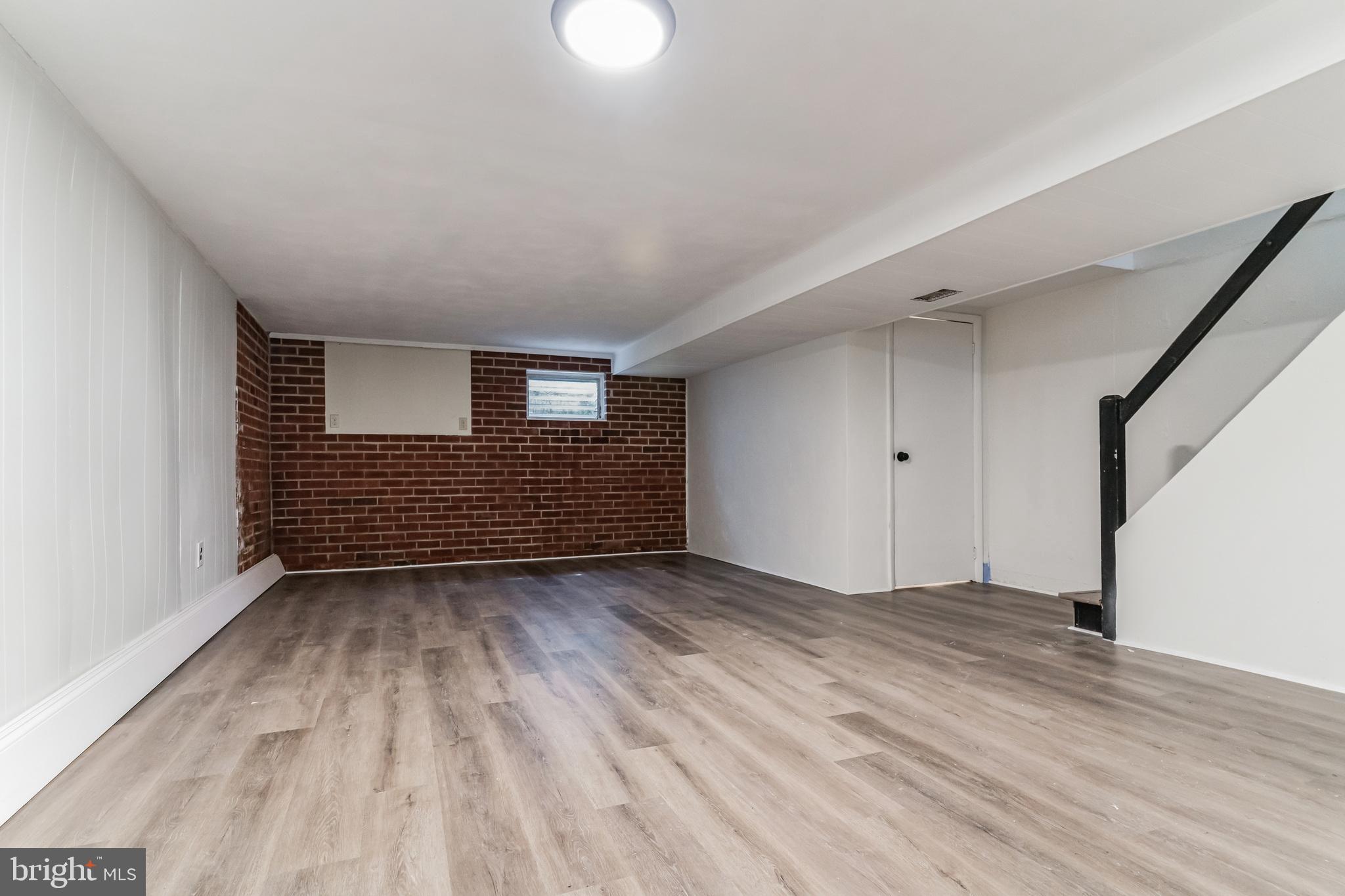 223 Fitzwilliams Road Bryn Mawr, PA 19010 - Photo 25 of 29 a view of an empty room with wooden floor and a window