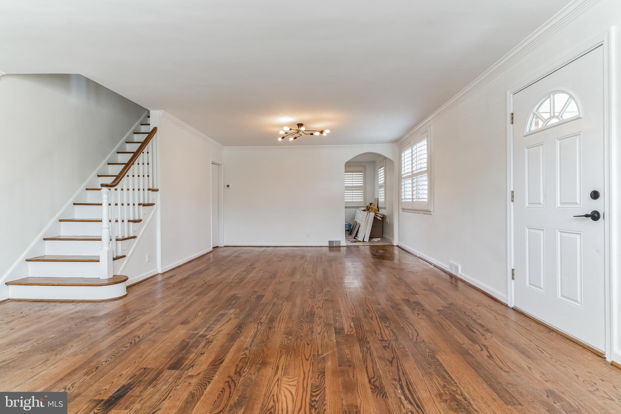 223 Fitzwilliams Road Bryn Mawr, PA 19010 - Photo 5 of 29 a view of a livingroom with wooden floor and stairs