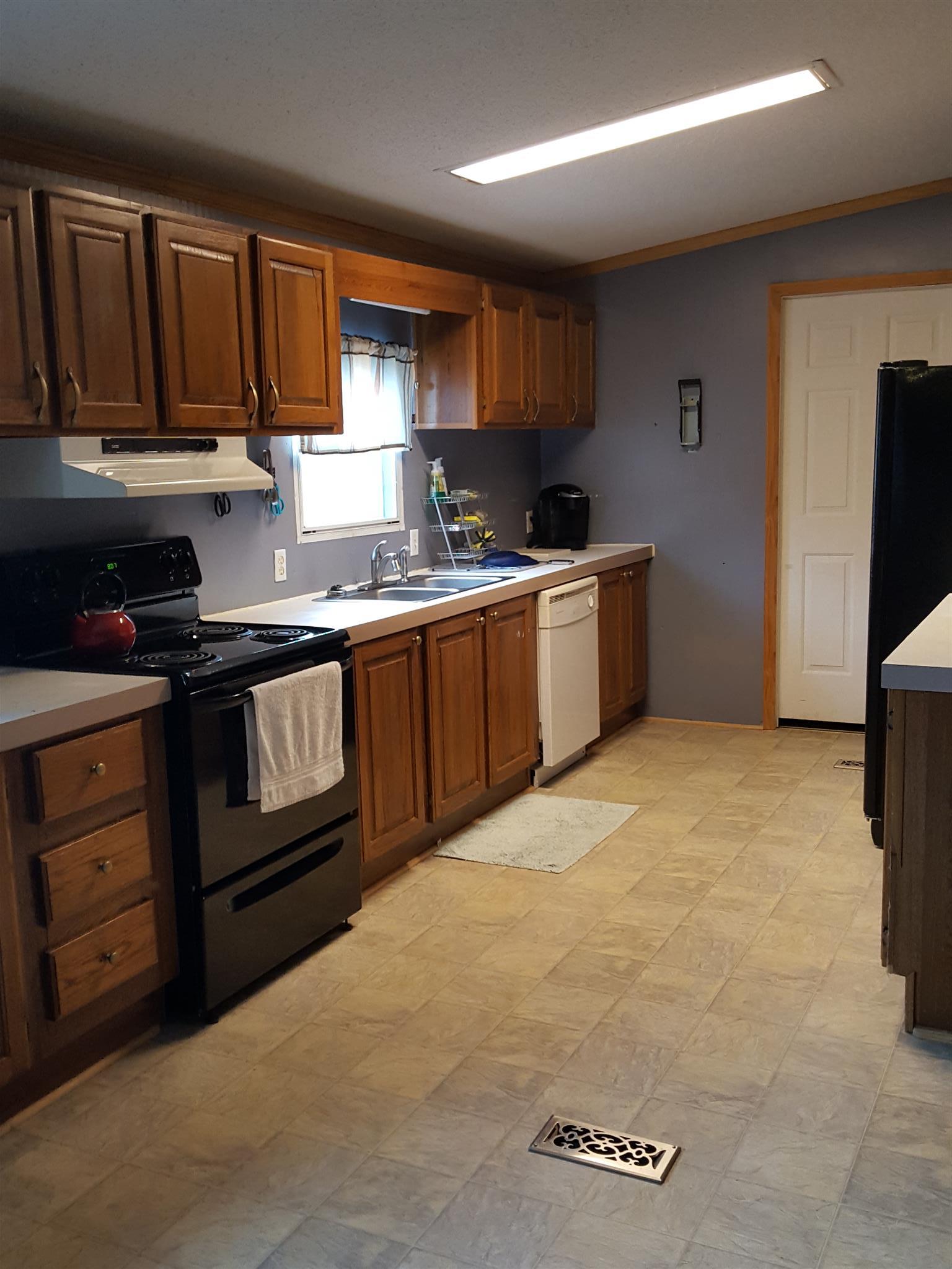 9646 Missionary Ridge Road Bon Aqua, TN 37025 - Photo 3 of 7 Very nice kitchen with a lot of drawers for storage. Also a Den/Pantry room next to kitchen for storage