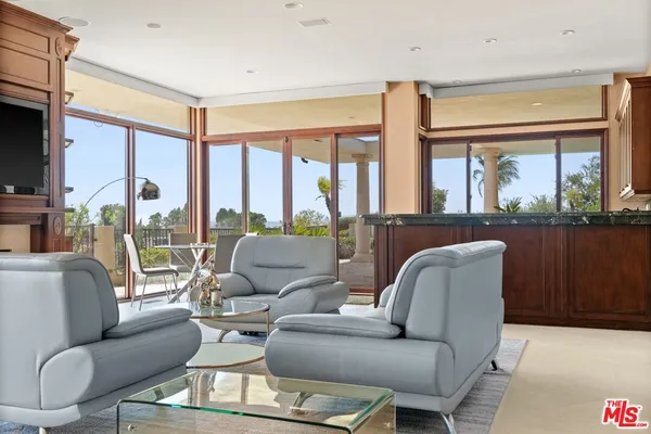 a view of a house with backyard and porch