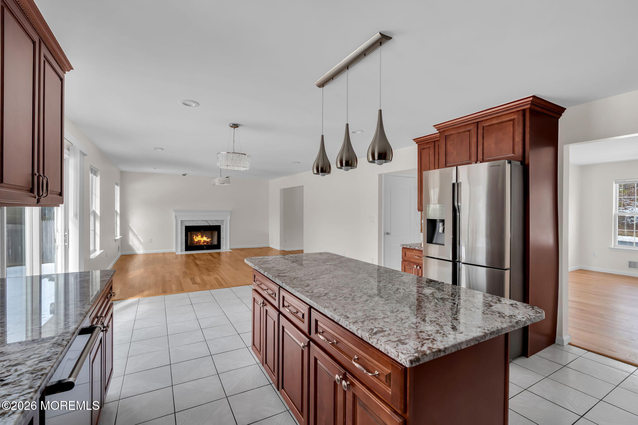 482 Meadowood Road Jackson, NJ 08527 - Photo 15 of 51 a kitchen with stainless steel appliances granite countertop a sink refrigerator and microwave