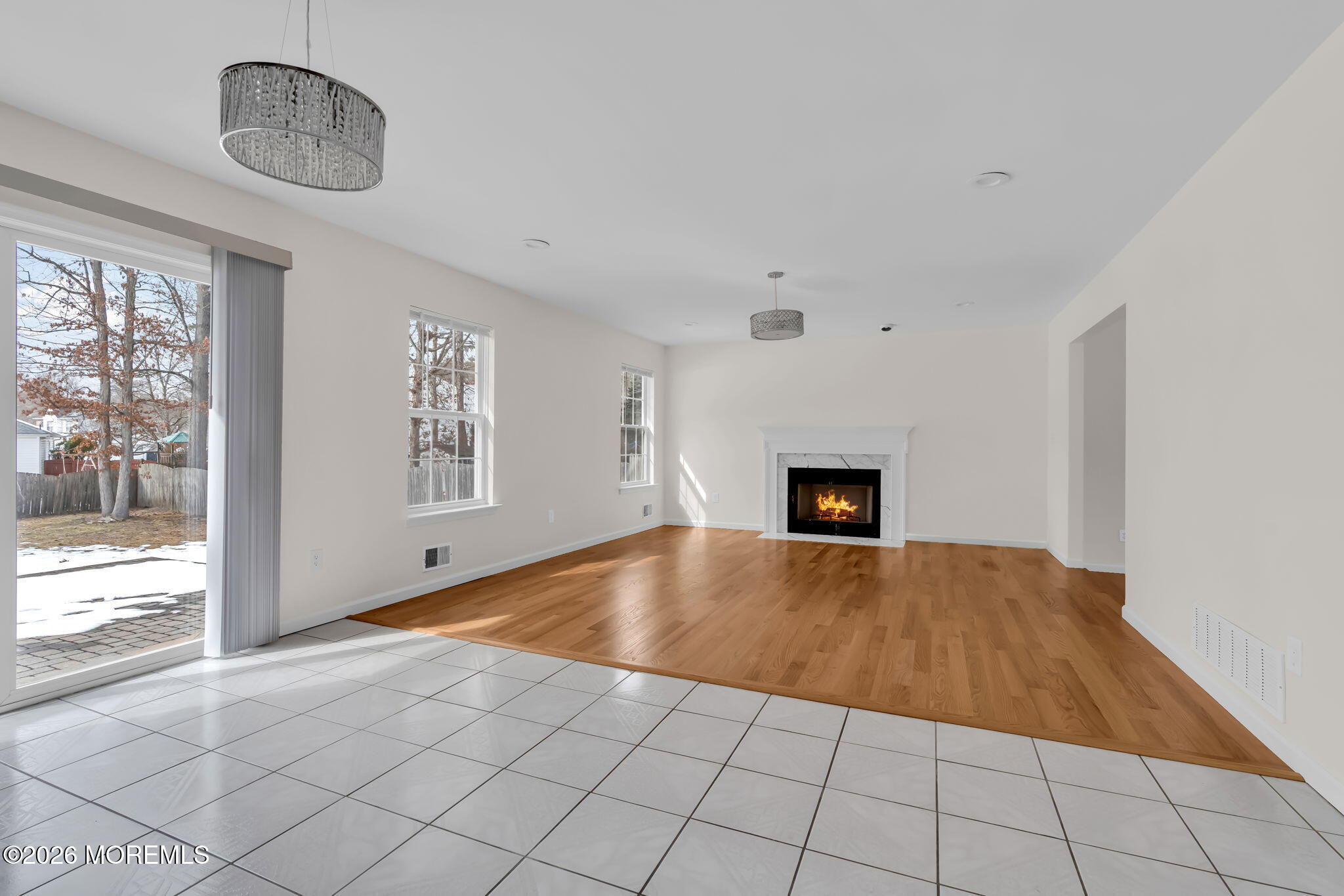 482 Meadowood Road Jackson, NJ 08527 - Photo 18 of 51 a view of empty room with wooden floor and fireplace