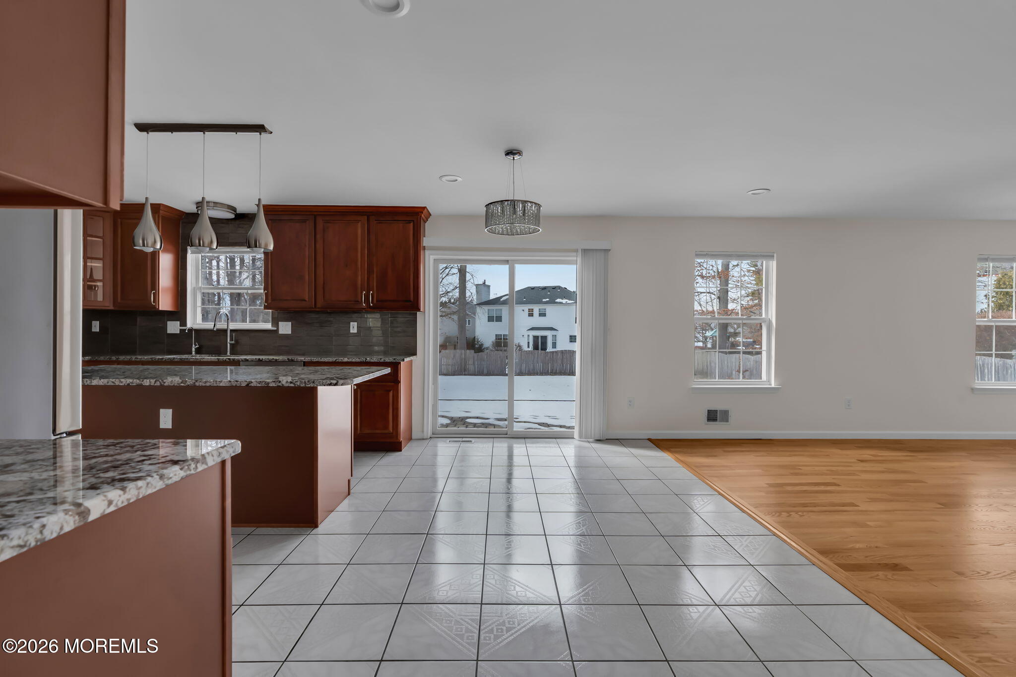 482 Meadowood Road Jackson, NJ 08527 - Photo 19 of 51 a kitchen with stainless steel appliances granite countertop a stove a sink and a microwave