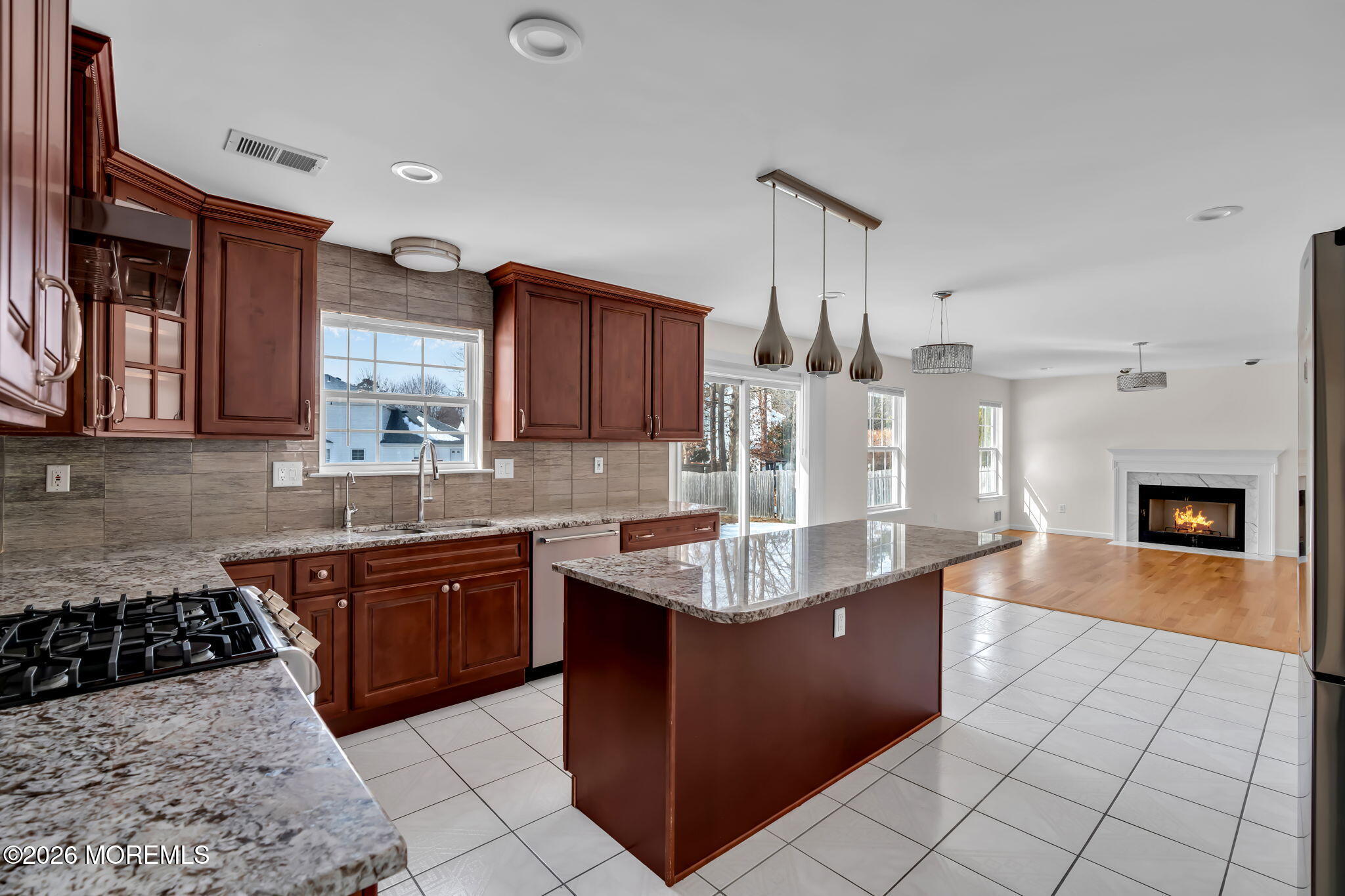 482 Meadowood Road Jackson, NJ 08527 - Photo 41 of 51 a large kitchen with stainless steel appliances granite countertop a sink counter space and cabinets
