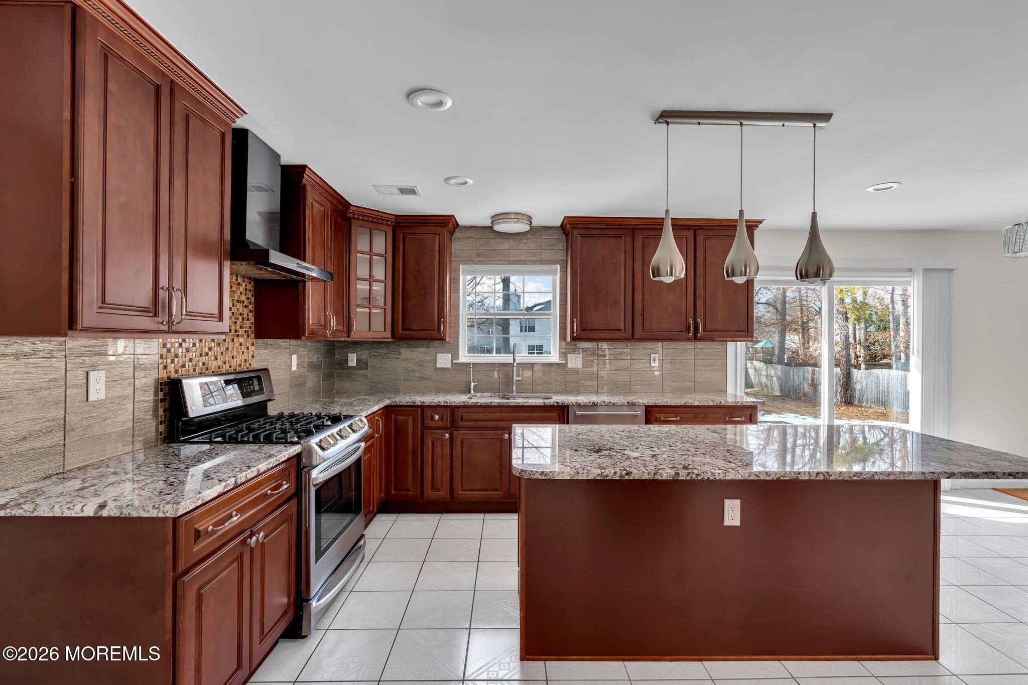 482 Meadowood Road Jackson, NJ 08527 - Photo 42 of 51 a kitchen with granite countertop a sink a stove and cabinets