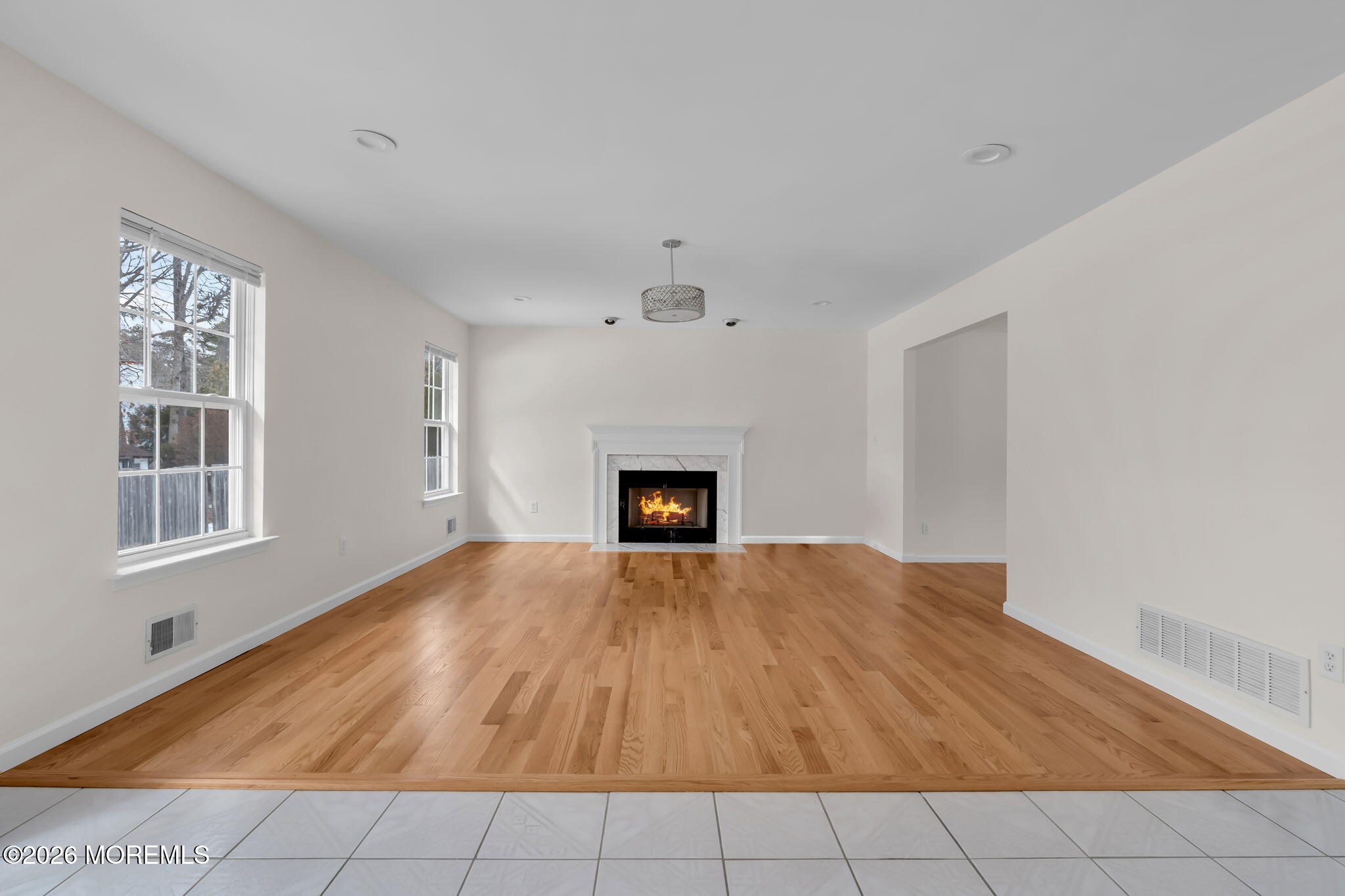 482 Meadowood Road Jackson, NJ 08527 - Photo 43 of 51 a view of an empty room with a fireplace and a window