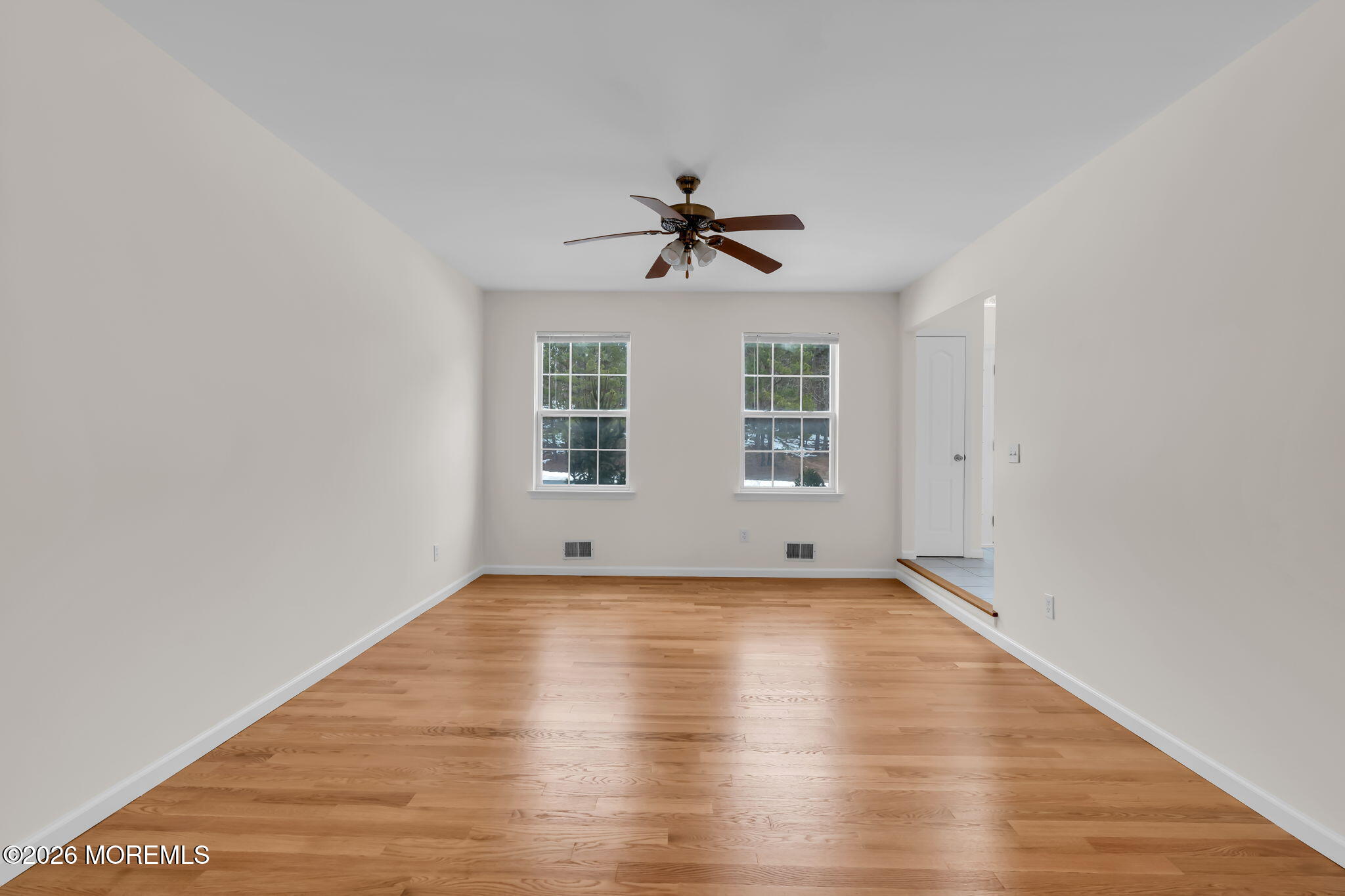 482 Meadowood Road Jackson, NJ 08527 - Photo 47 of 51 an empty room with wooden floor and windows