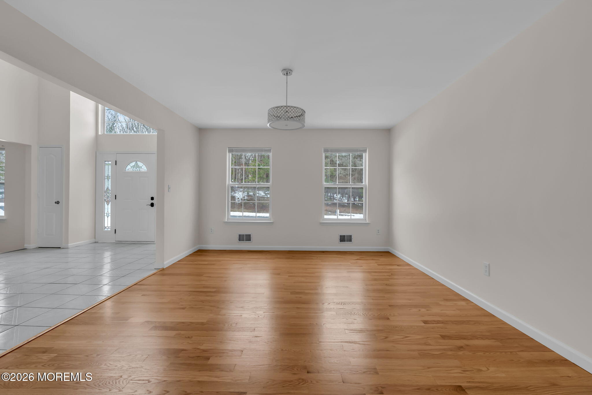 482 Meadowood Road Jackson, NJ 08527 - Photo 50 of 51 an empty room with wooden floor and windows