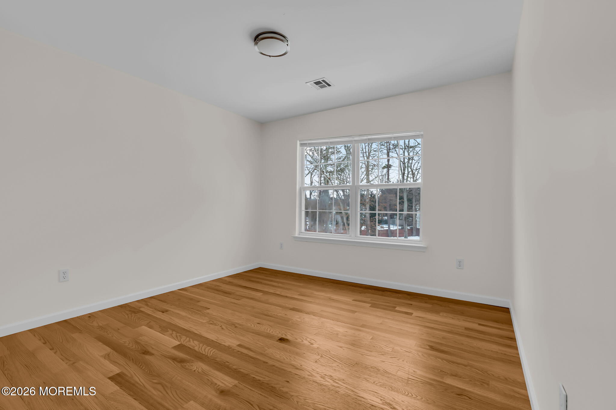 482 Meadowood Road Jackson, NJ 08527 - Photo 5 of 51 a view of an empty room with a window