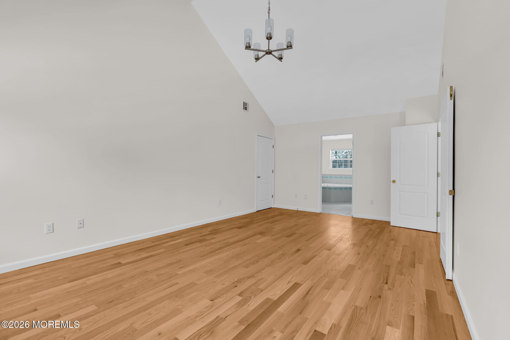 482 Meadowood Road Jackson, NJ 08527 - Photo 8 of 51 a view of empty room with wooden floor and fan