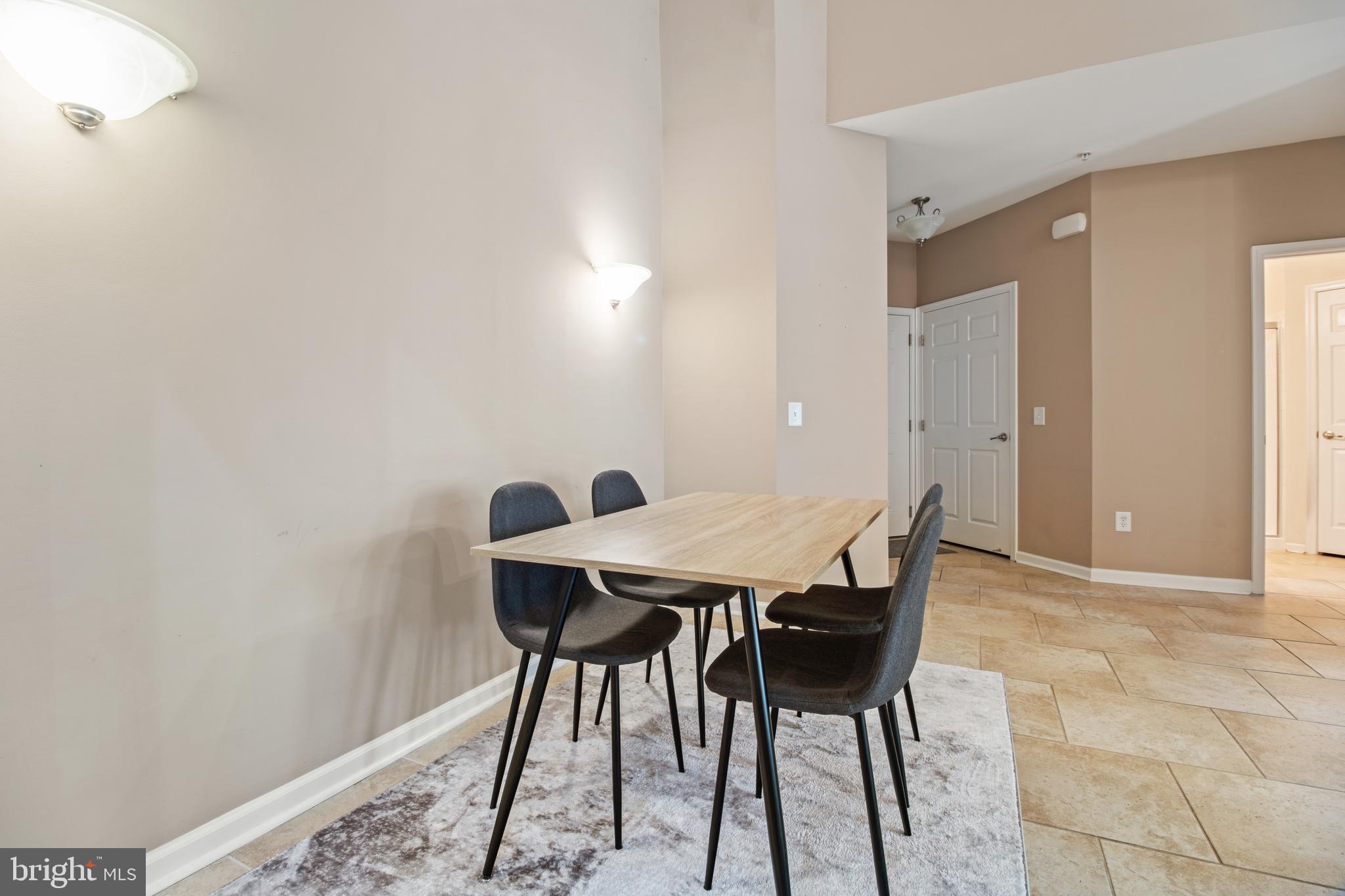 1622 Hardwick Court, Unit 403 Hanover, MD 21076 - Photo 11 of 21 a view of a workspace and a table in a room