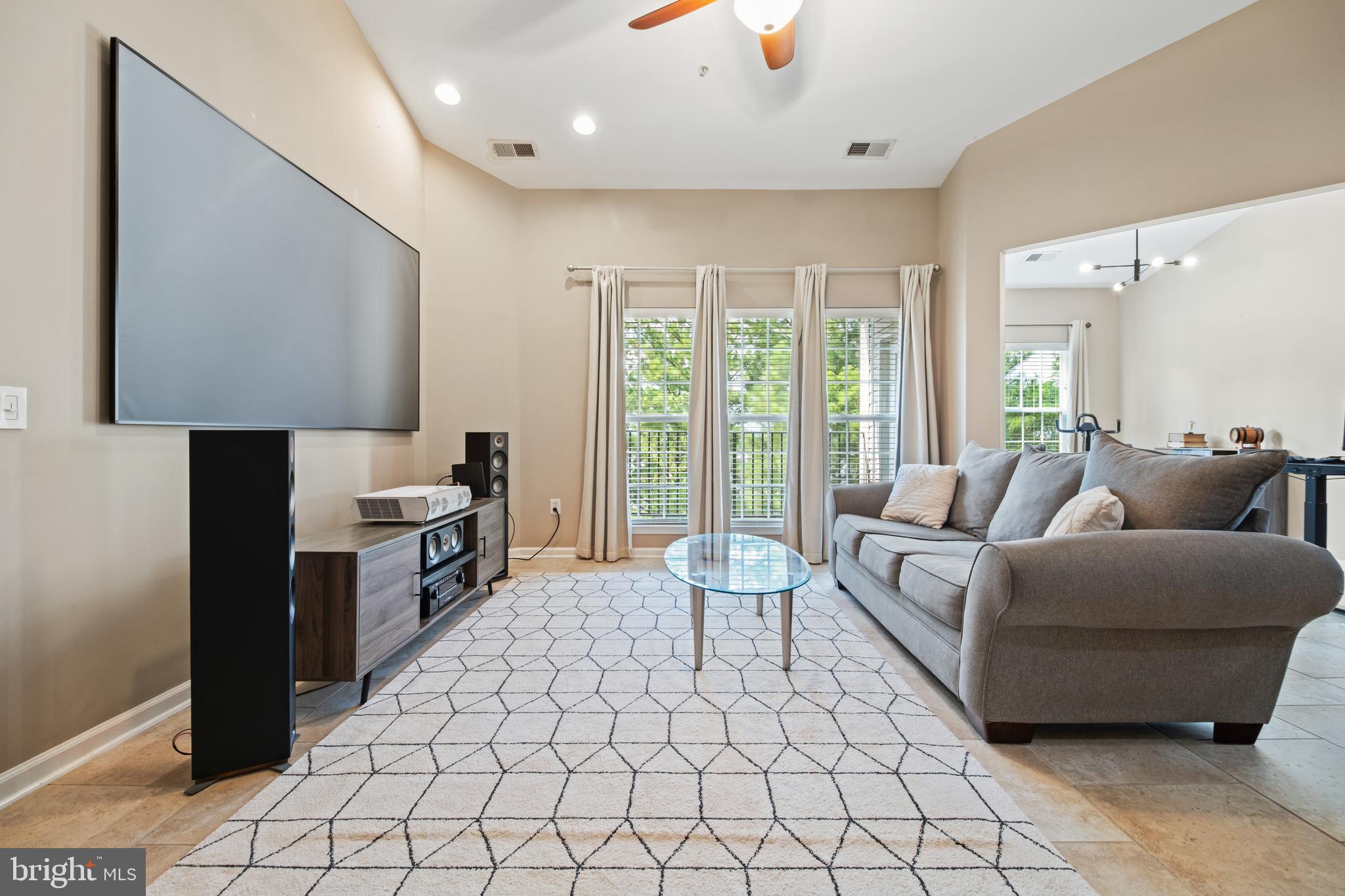 1622 Hardwick Court, Unit 403 Hanover, MD 21076 - Photo 5 of 21 a living room with furniture and a flat screen tv
