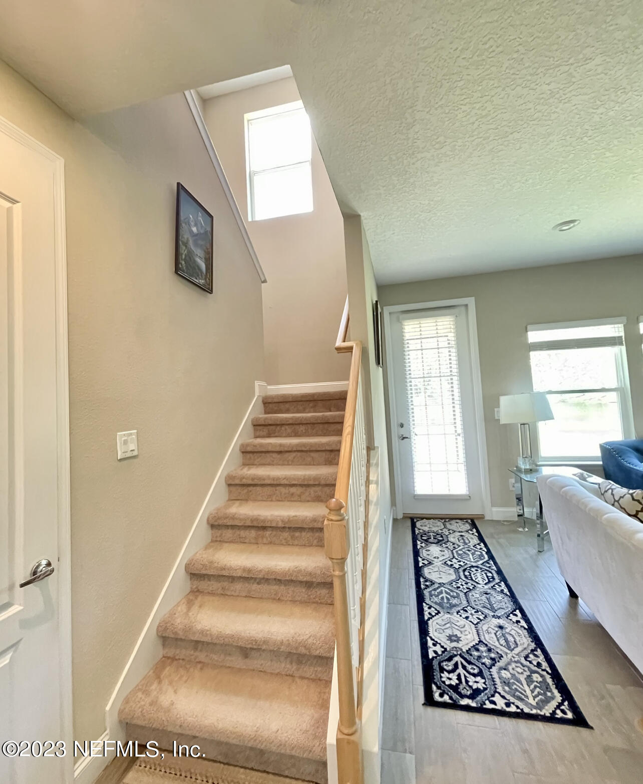 207 Silver Creek Place St. Augustine, FL 32095 - Photo 13 of 32 a view of an entryway with wooden floor and a rug