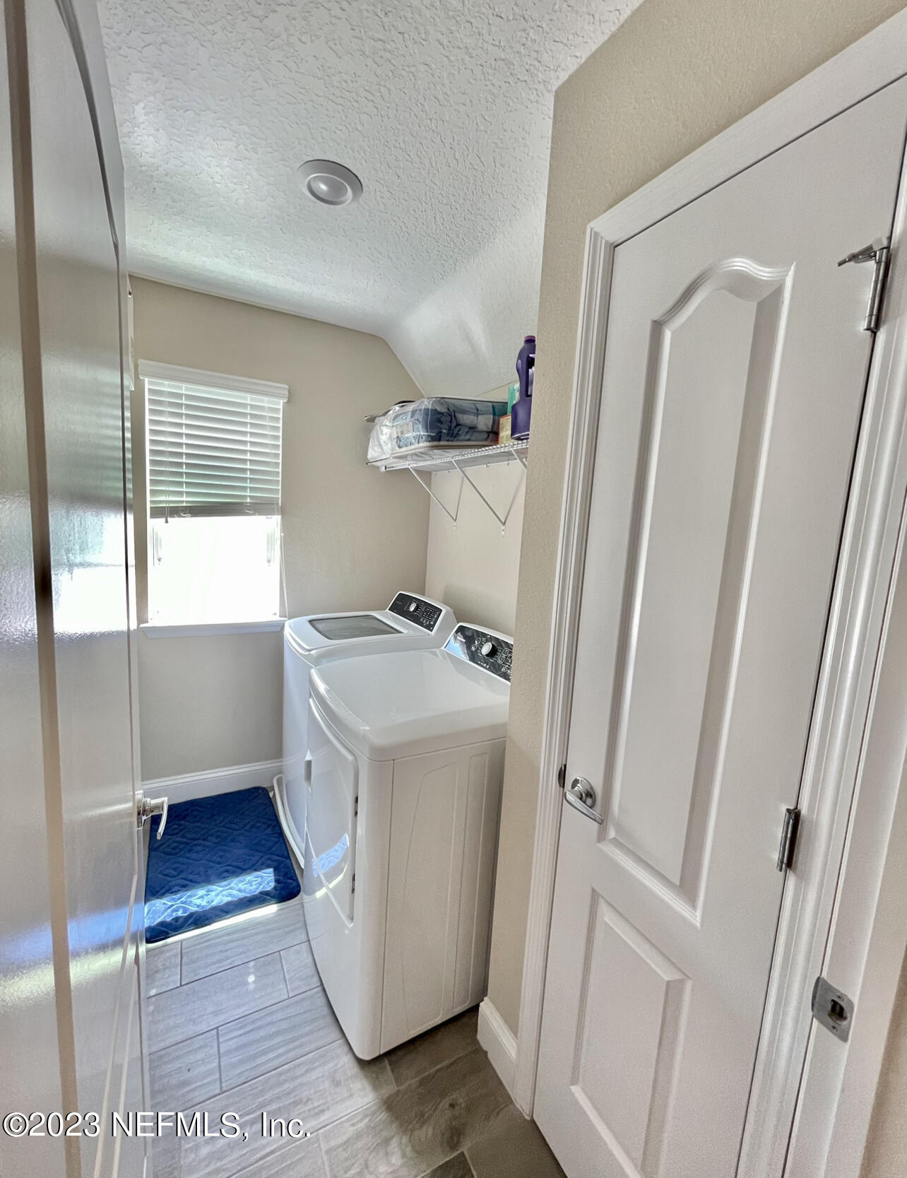 207 Silver Creek Place St. Augustine, FL 32095 - Photo 17 of 32 a view of storage and utility room with washer and dryer