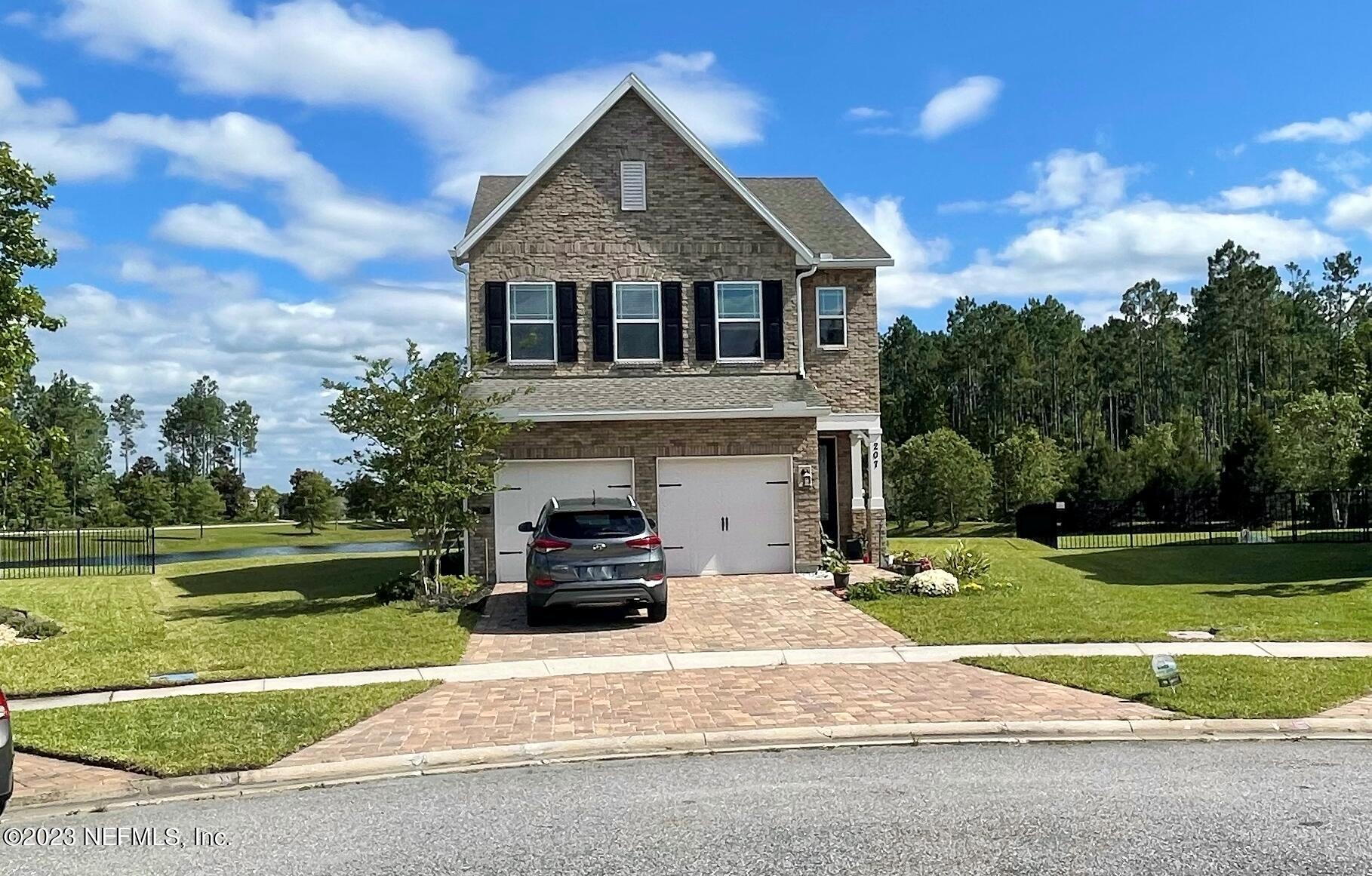 207 Silver Creek Place St. Augustine, FL 32095 - Photo 2 of 32 a house view with a garden space