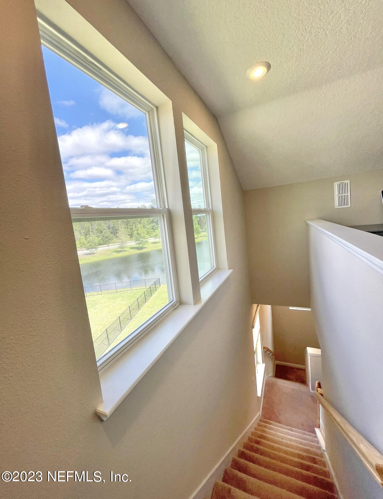 207 Silver Creek Place St. Augustine, FL 32095 - Photo 21 of 32 a view of a room with wooden floor and windows