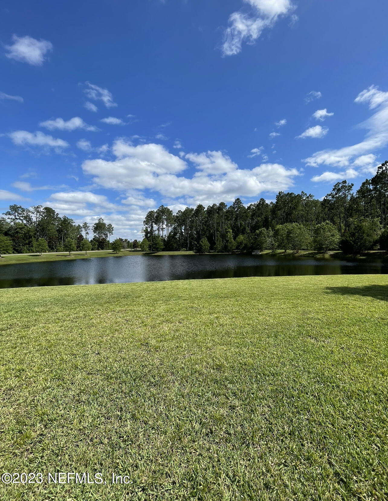 207 Silver Creek Place St. Augustine, FL 32095 - Photo 24 of 32 a view of a lake with a big yard